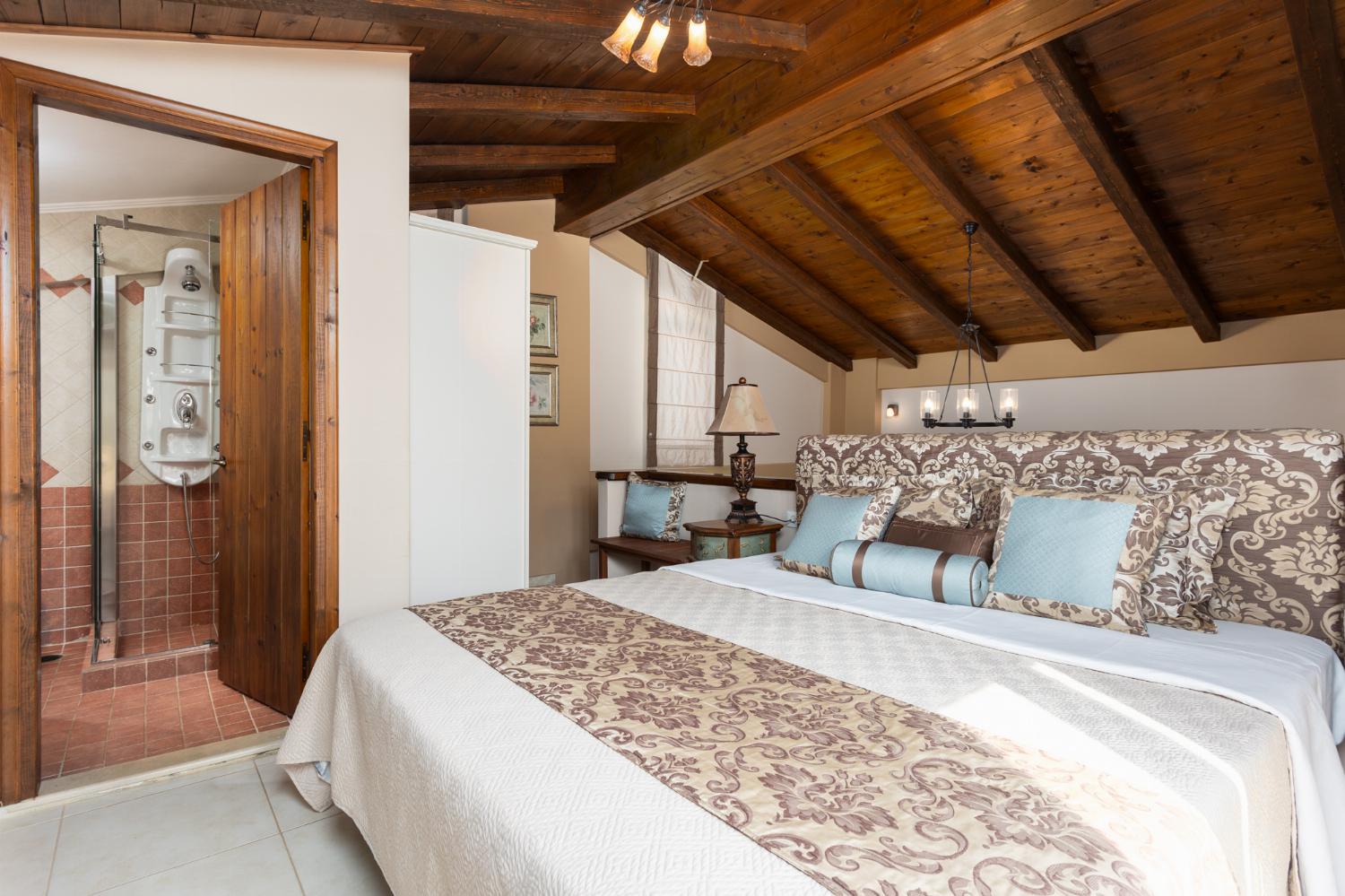 Double bedroom on mezzanine with en suite bathroom and A/C