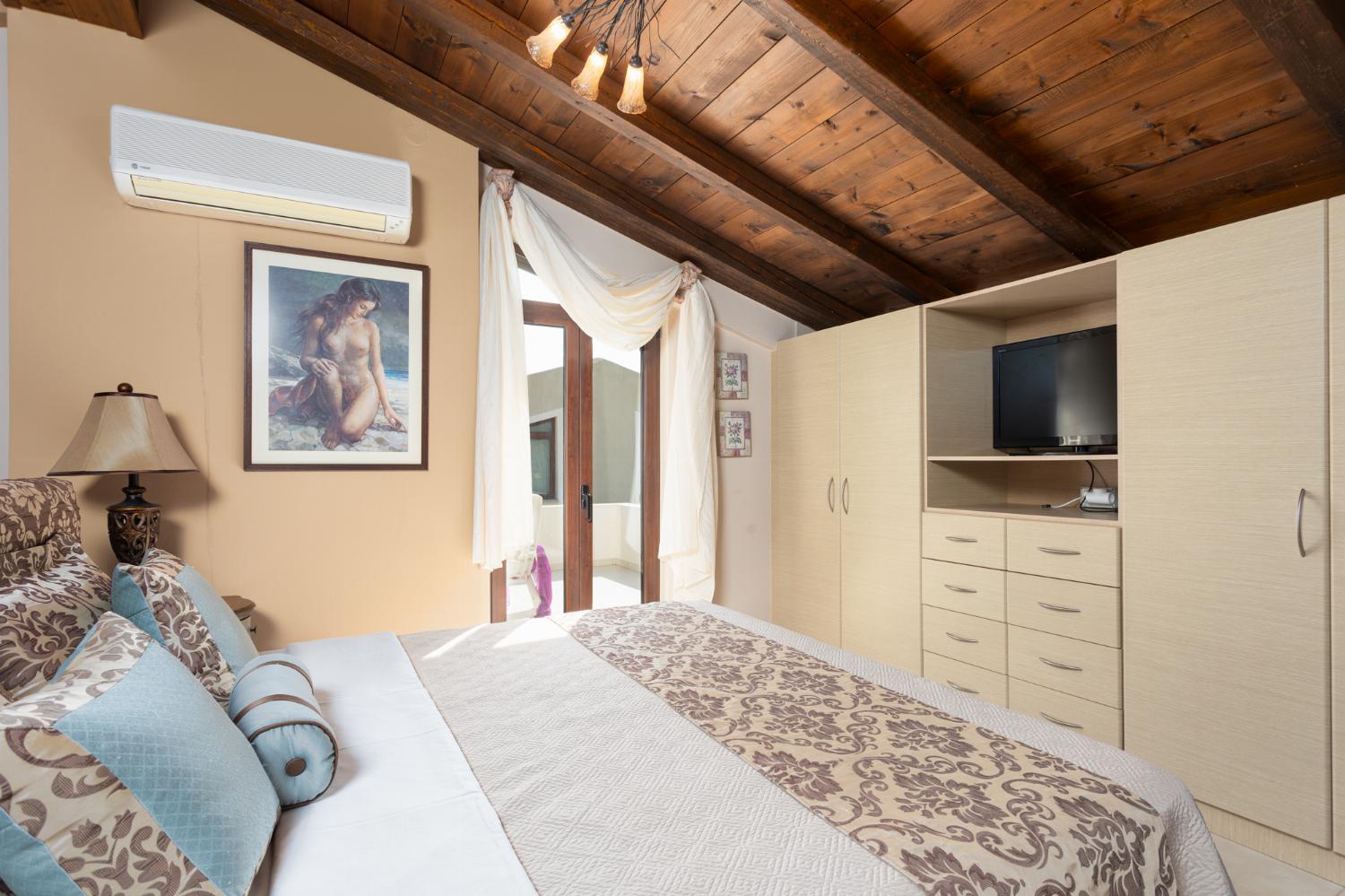 Double bedroom on mezzanine with en suite bathroom and A/C