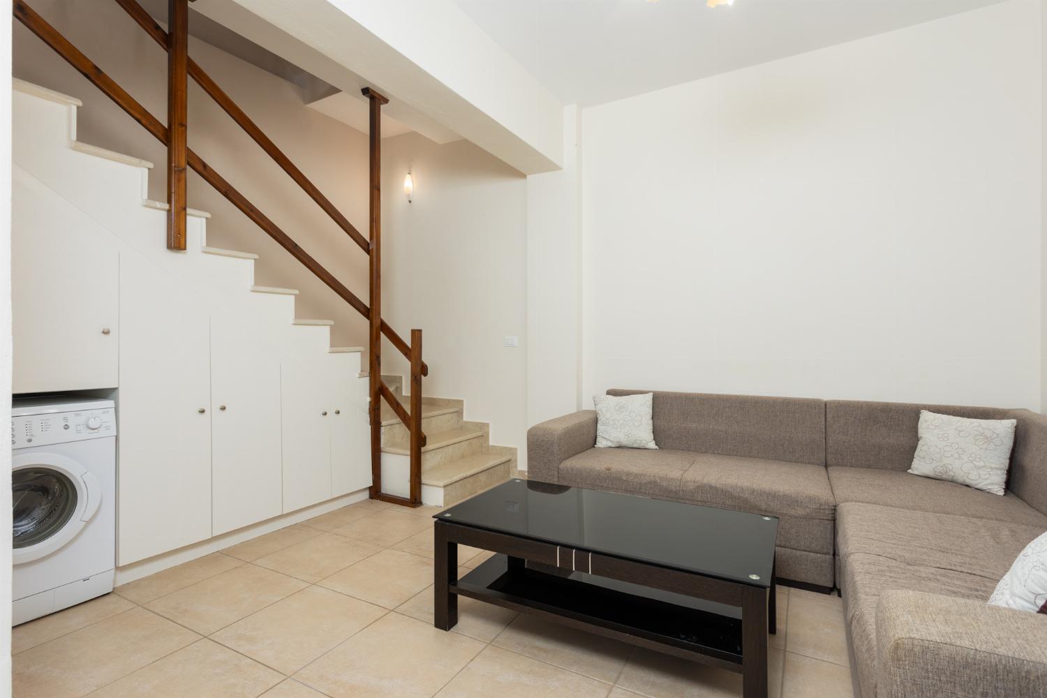 Living area with sofa and kitchenette 