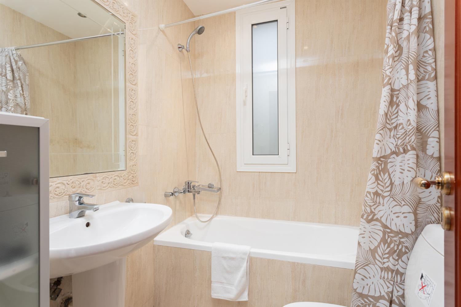 Family bathroom with bath and shower