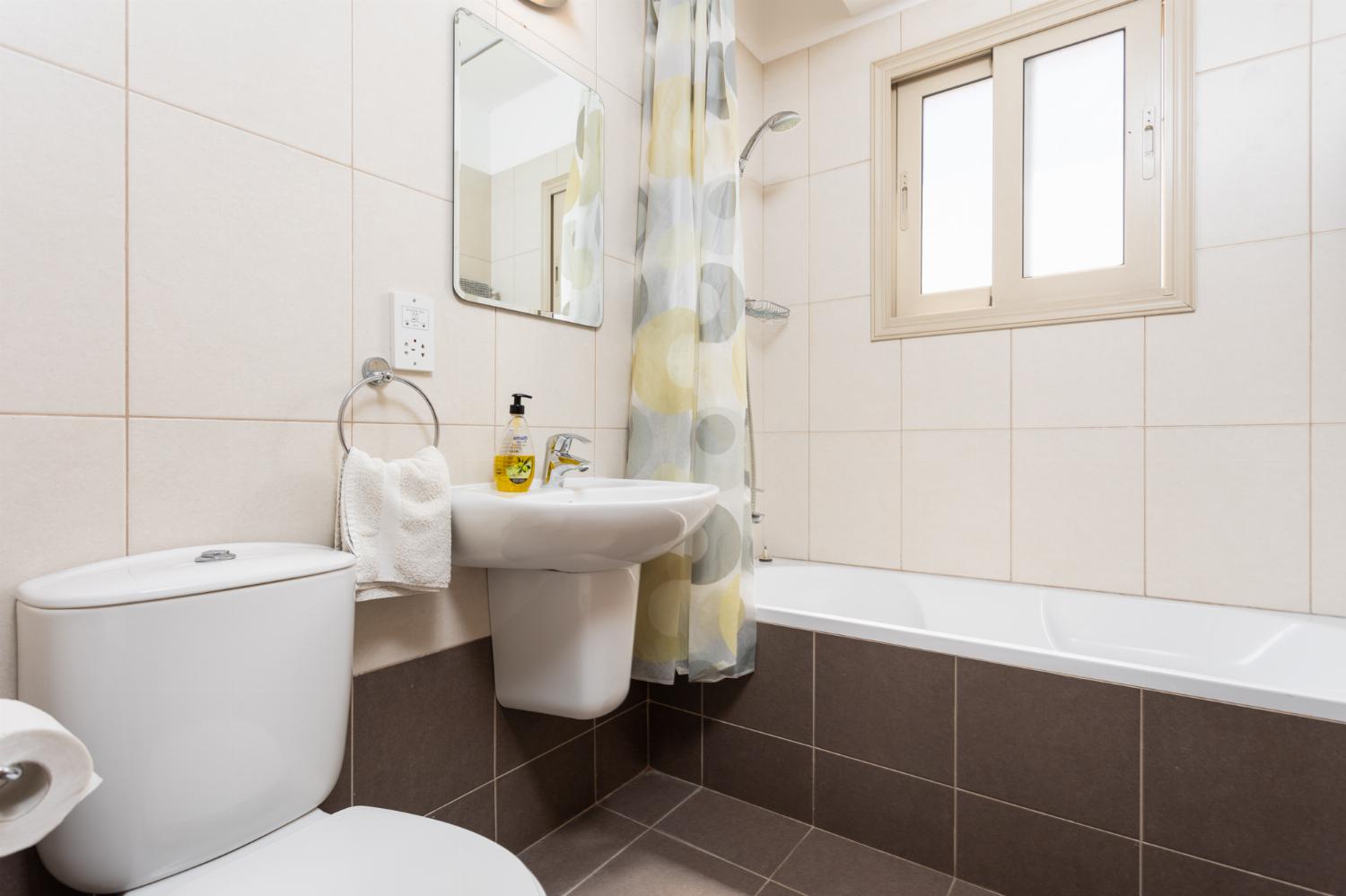 Family bathroom with bath and shower