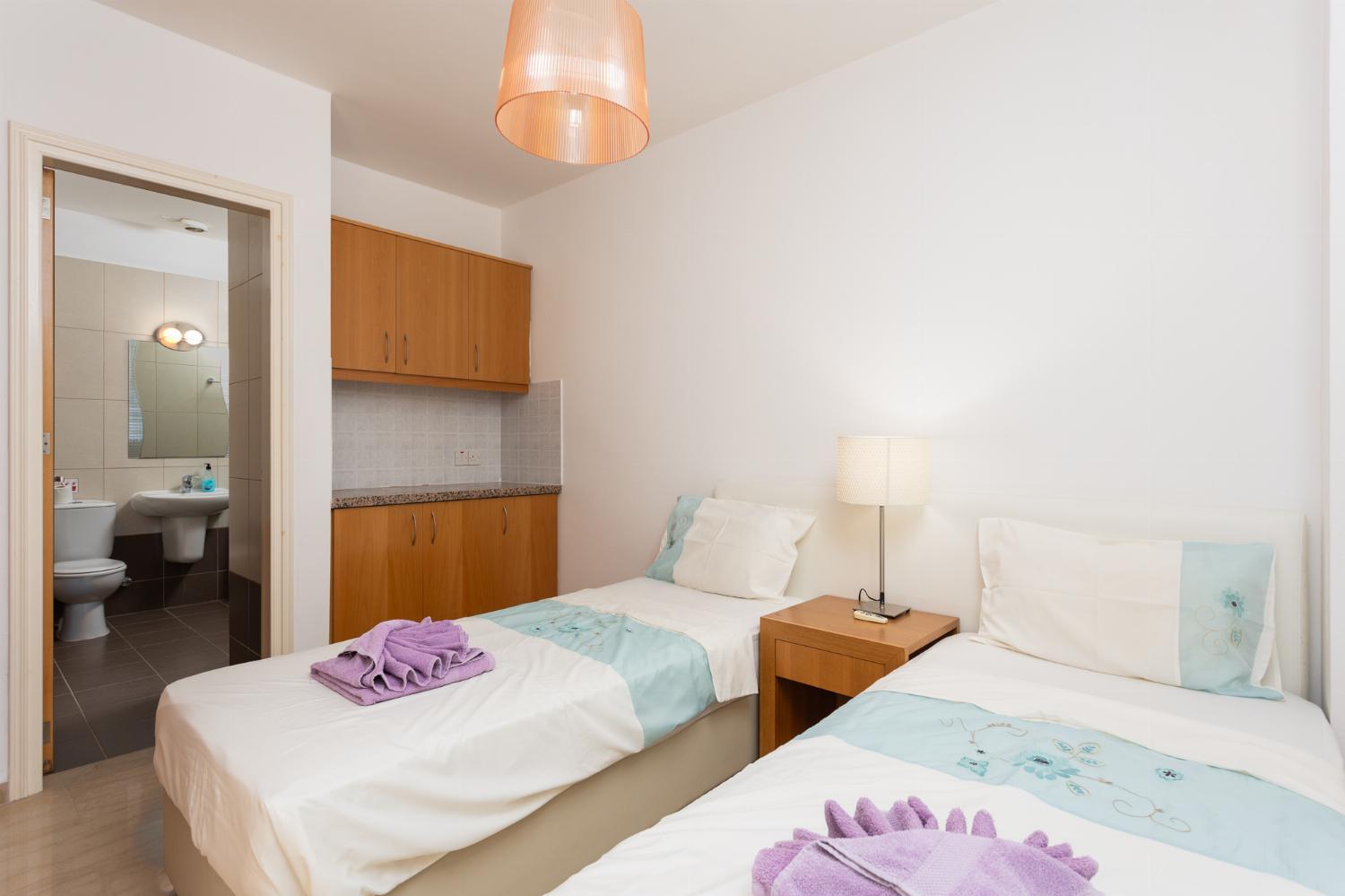 Twin bedroom with en suite bathroom and A/C