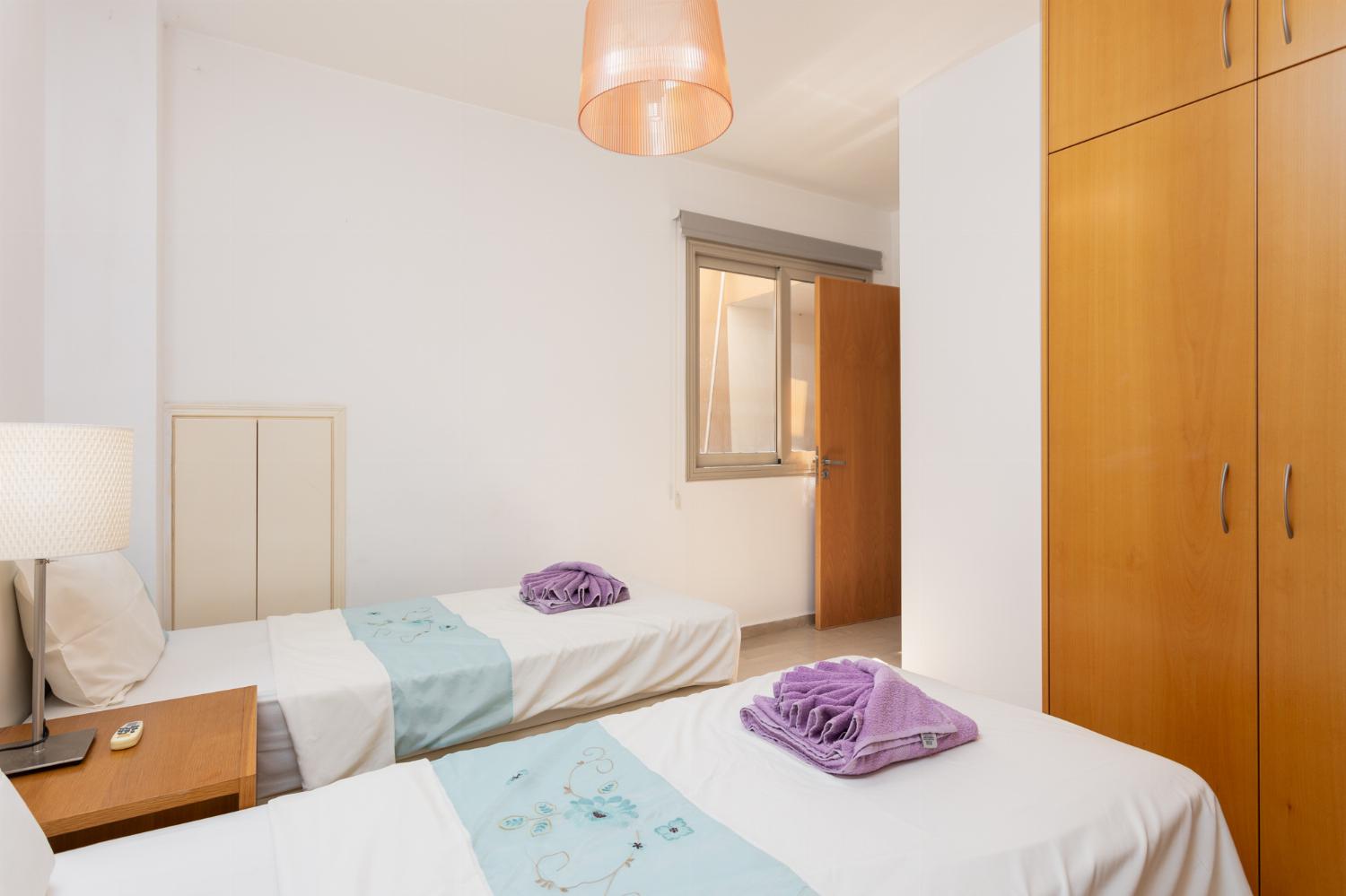 Twin bedroom with en suite bathroom and A/C