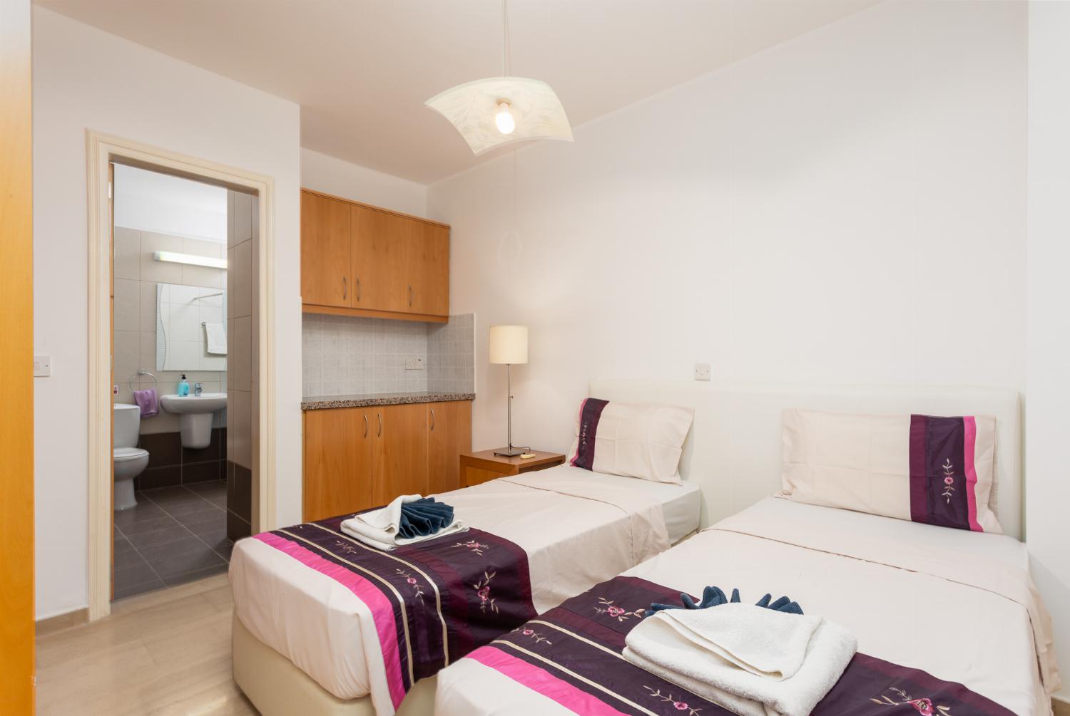 Twin bedroom with en suite bathroom and A/C