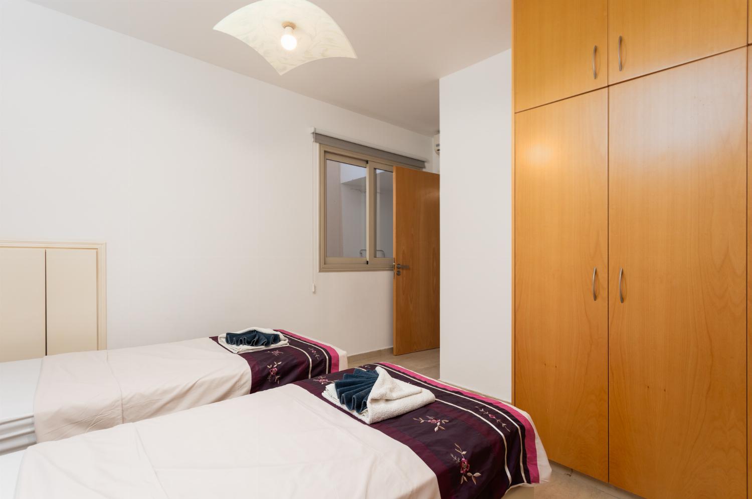 Twin bedroom with en suite bathroom and A/C