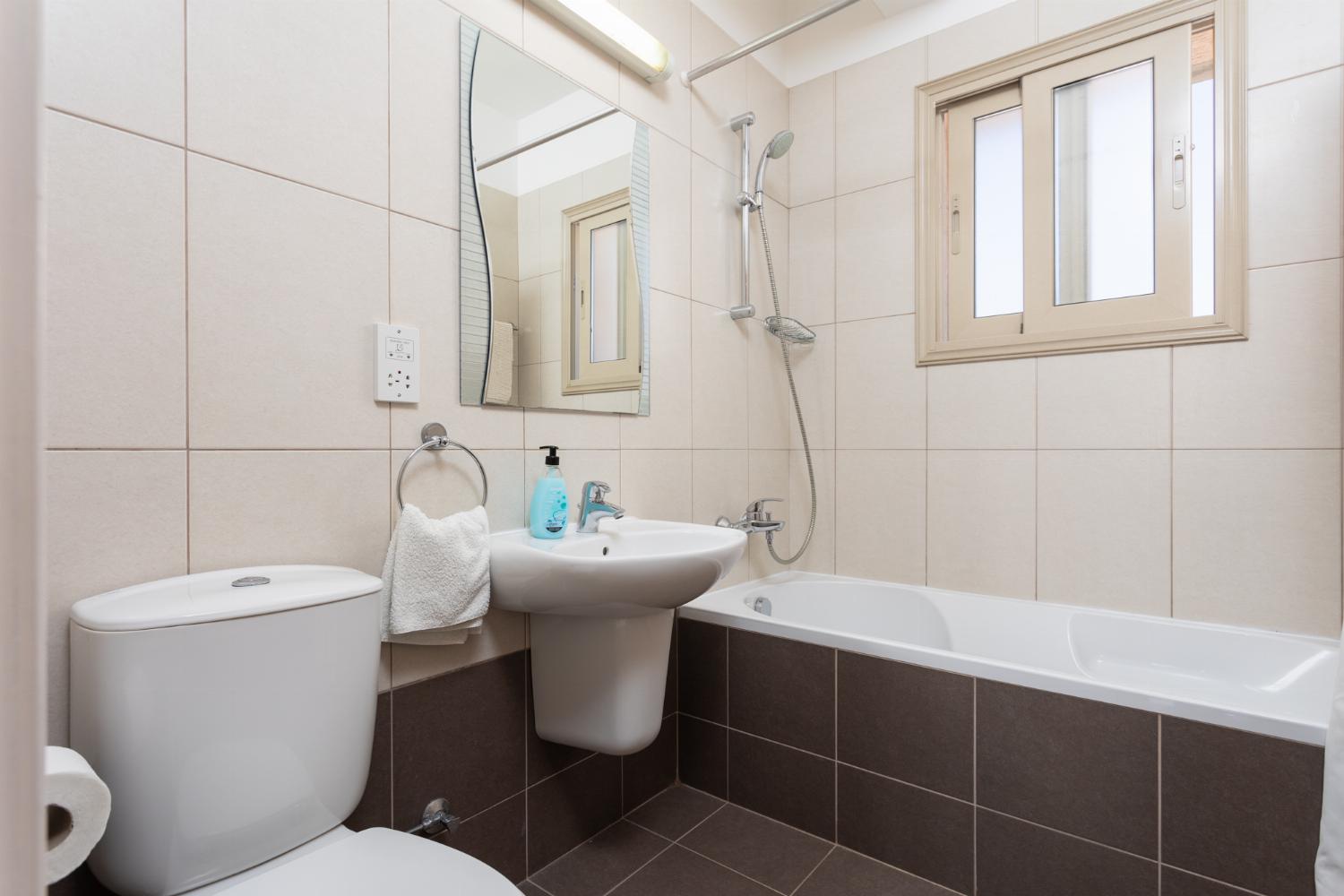 Family bathroom with bath and shower