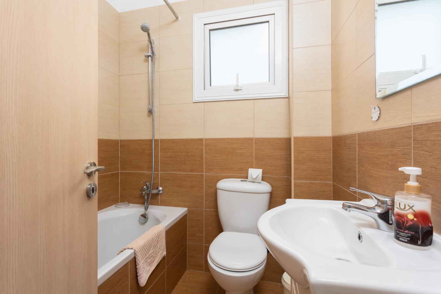 Family bathroom with bath and shower
