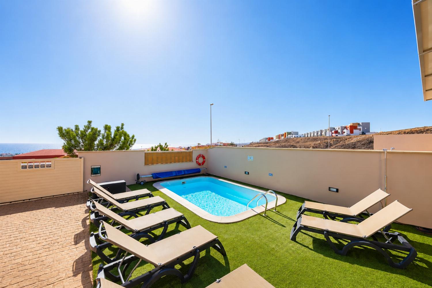 Pool and terrace with sea views