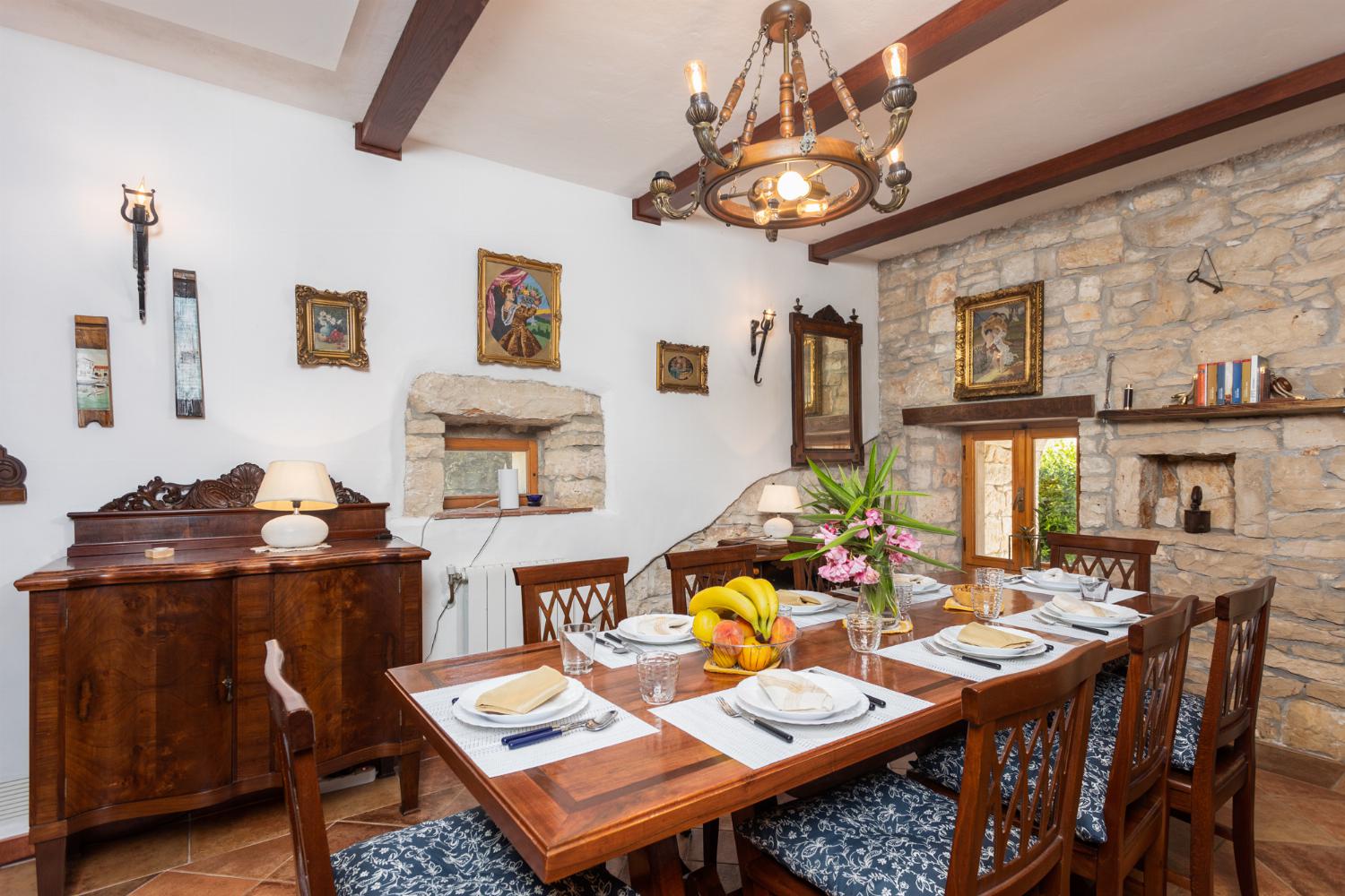 Living room on ground floor with sofas, dining area, ornamental fireplace, WiFi internet, and satellite TV