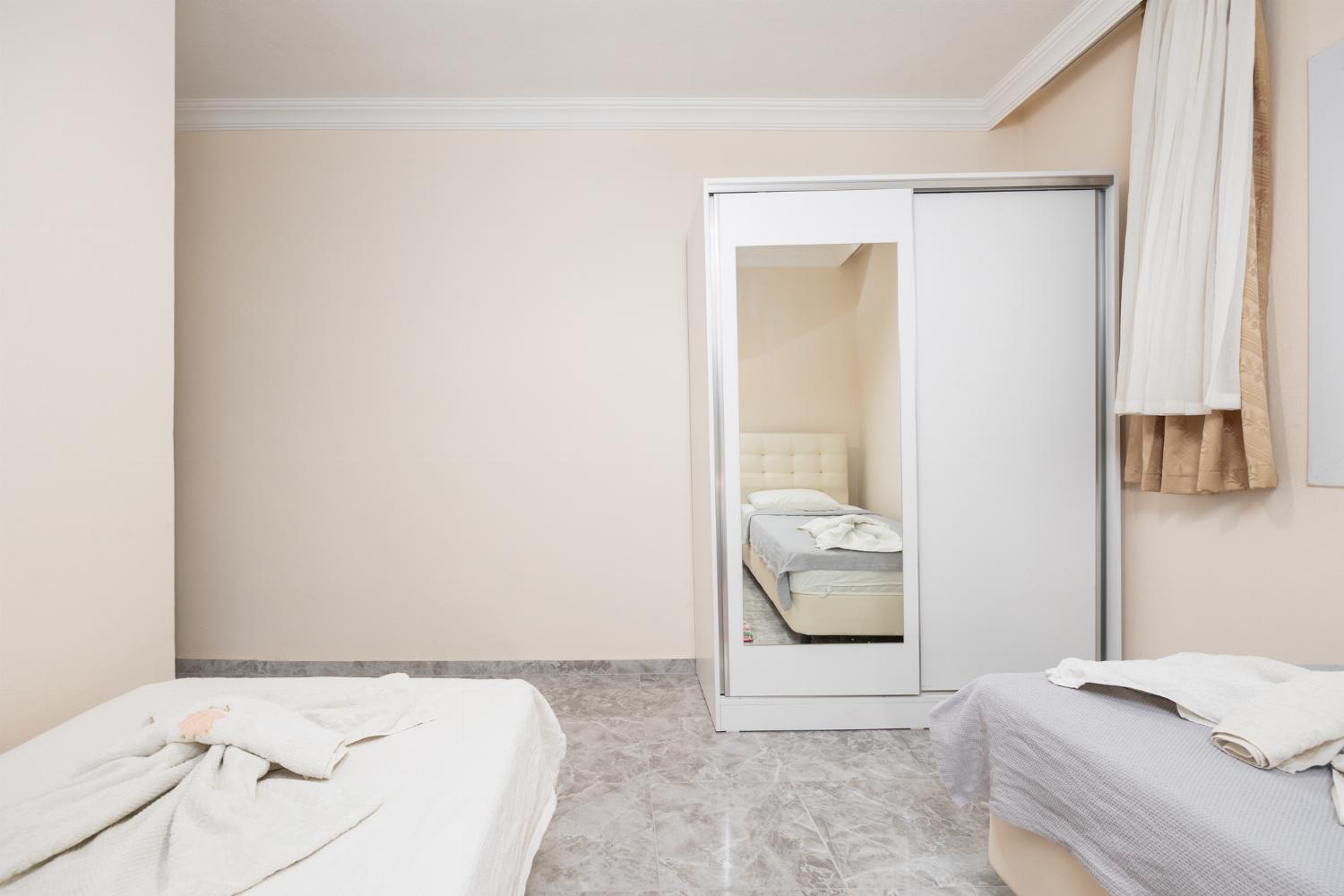 Twin bedroom with en suite bathroom and A/C