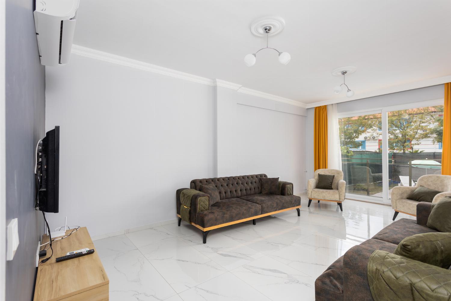 Living room with sofas, A/C, WiFi internet, and satellite TV