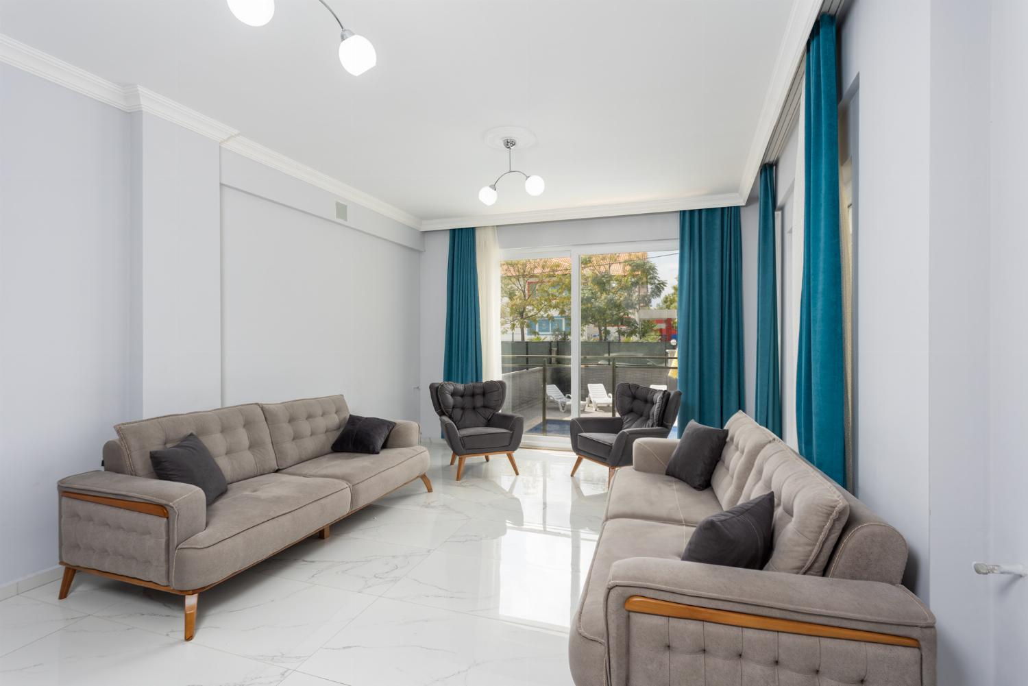 Living room with sofas, A/C, WiFi internet, and satellite TV