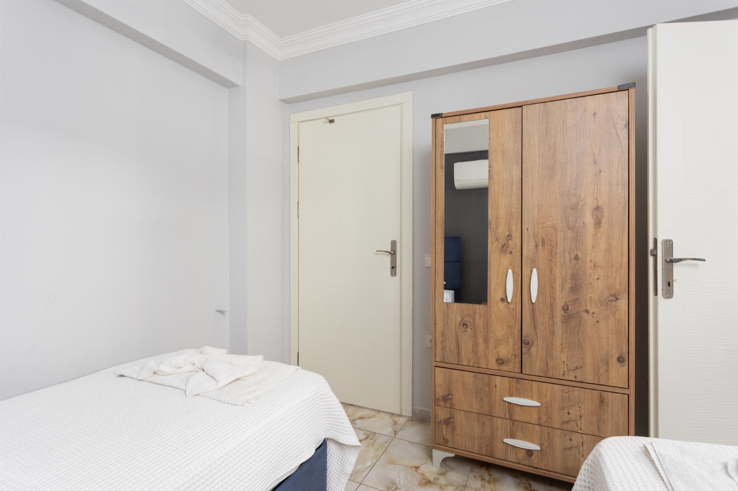 Twin bedroom with en suite bathroom and A/C