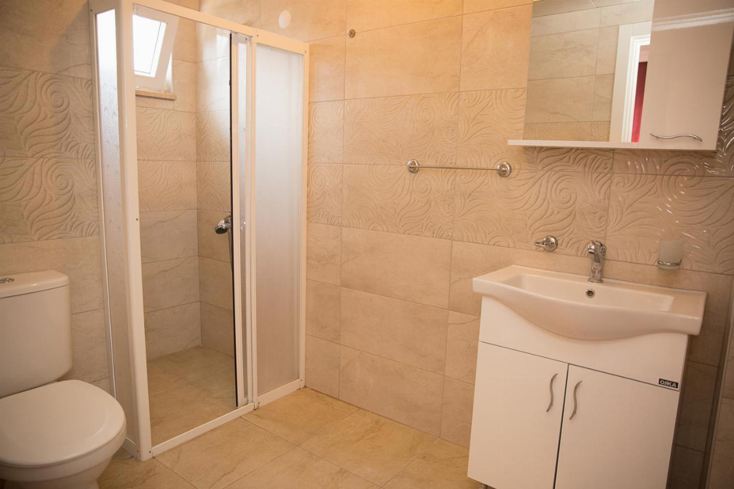 En suite bathroom with shower and WC