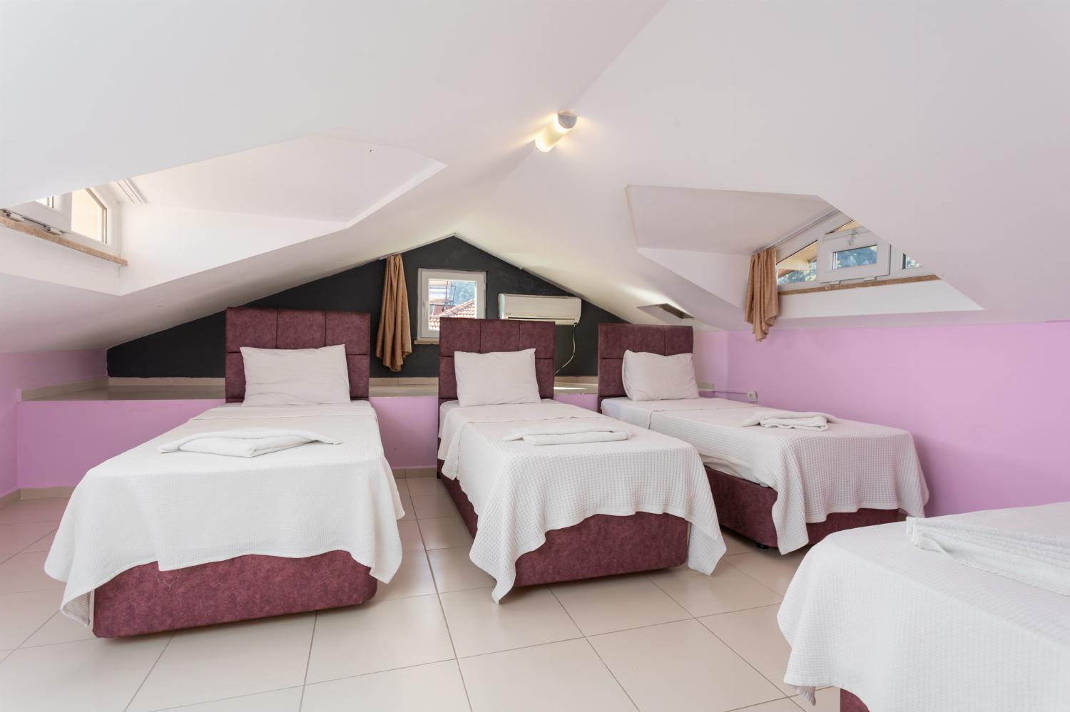 Bedroom with 4 single beds and A/C