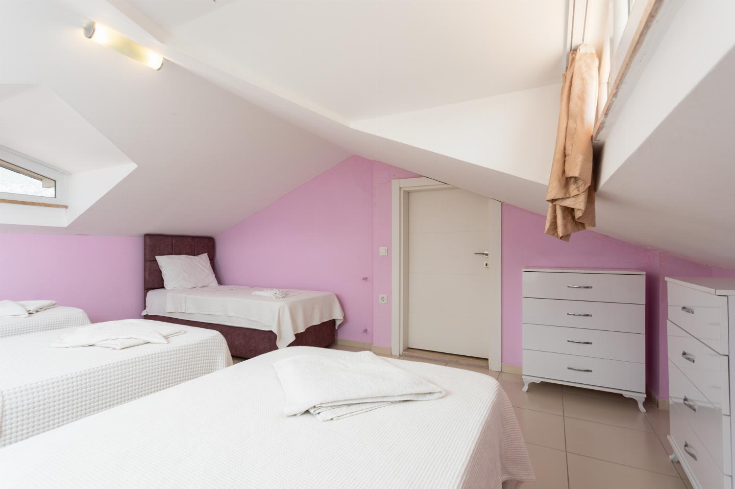 Bedroom with 4 single beds and A/C