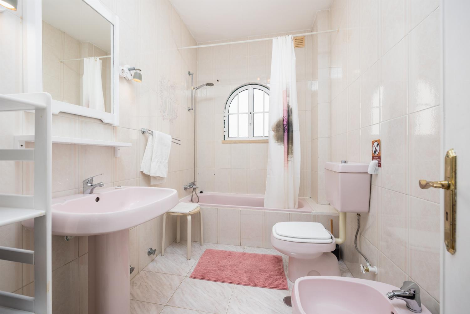 Family bathroom with bath and shower