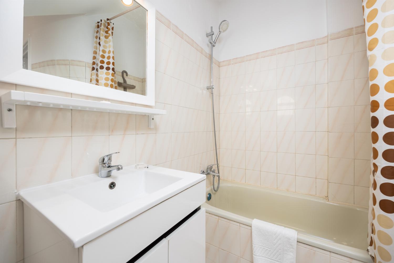 Family bathroom with bath and shower