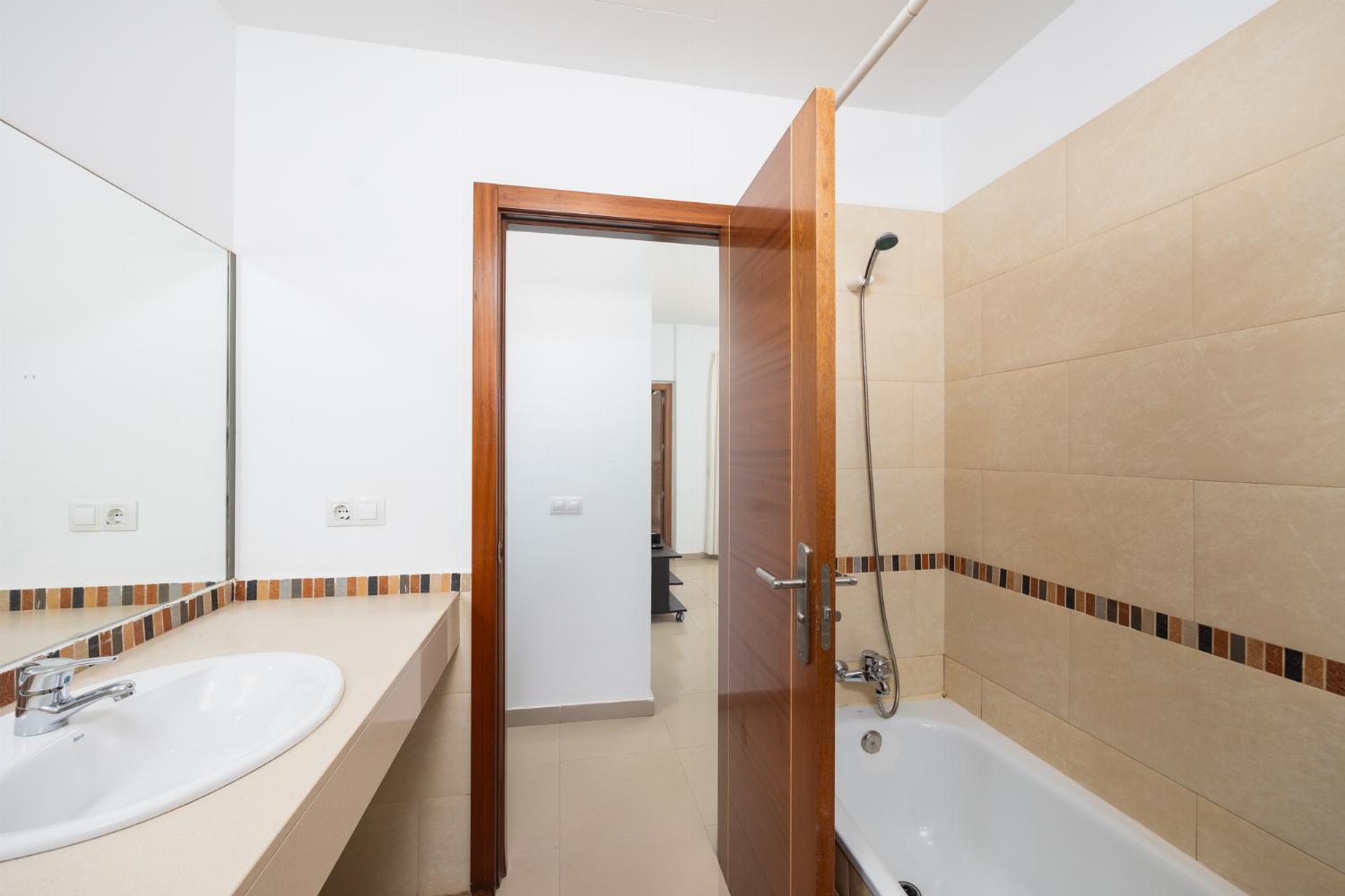 Family bathroom with bath and shower