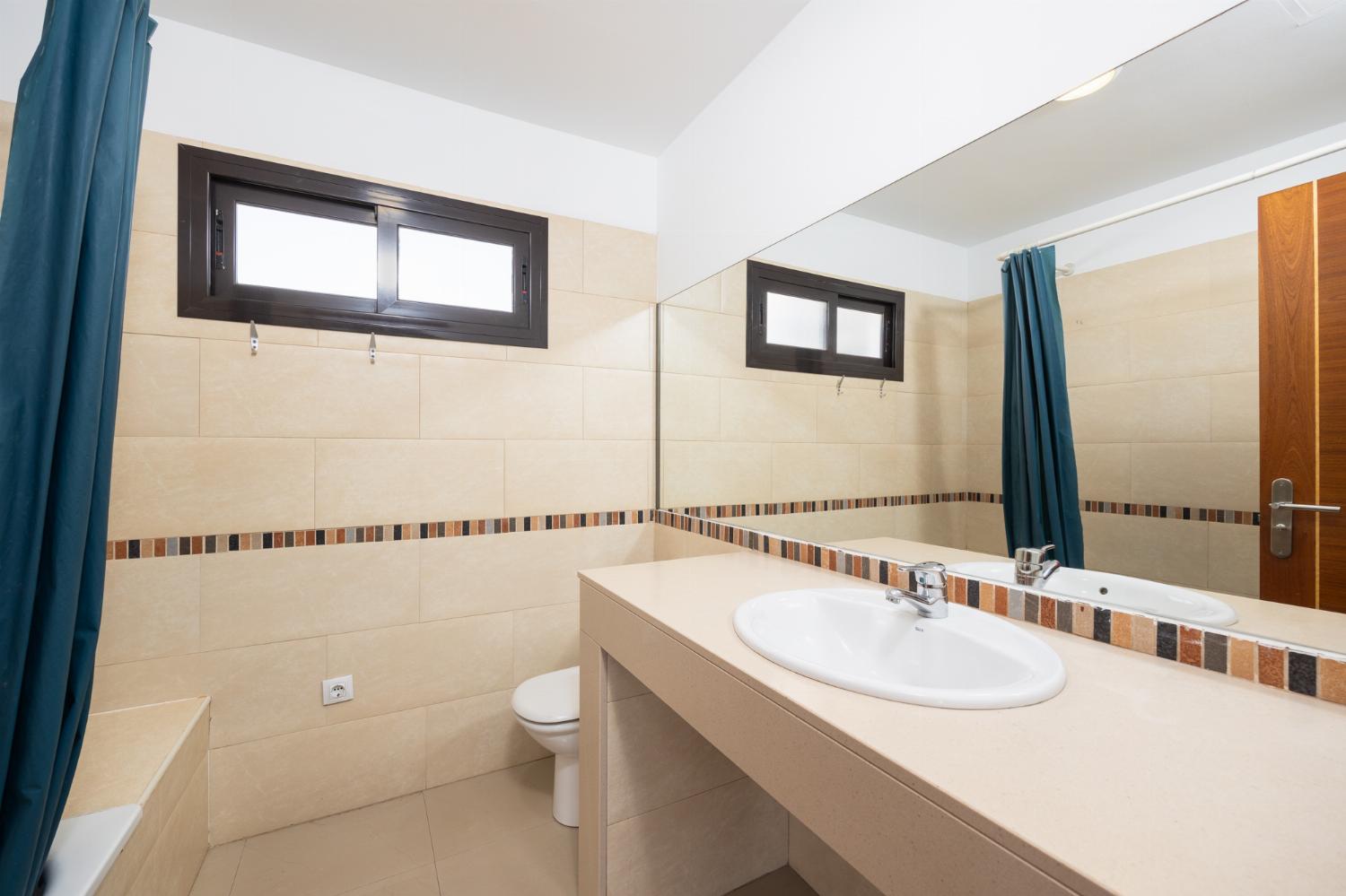 Family bathroom with bath and shower