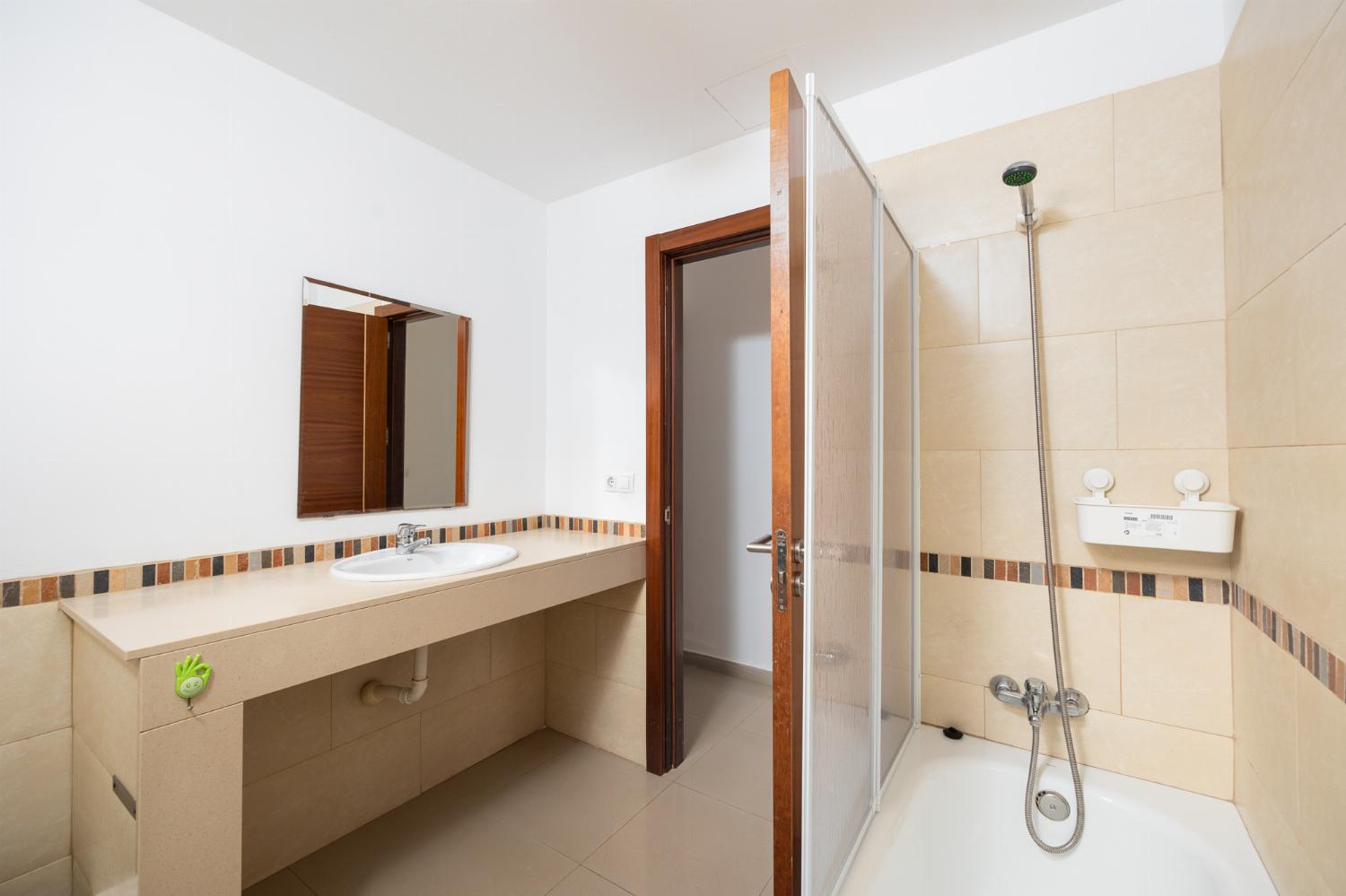Family bathroom with bath and shower