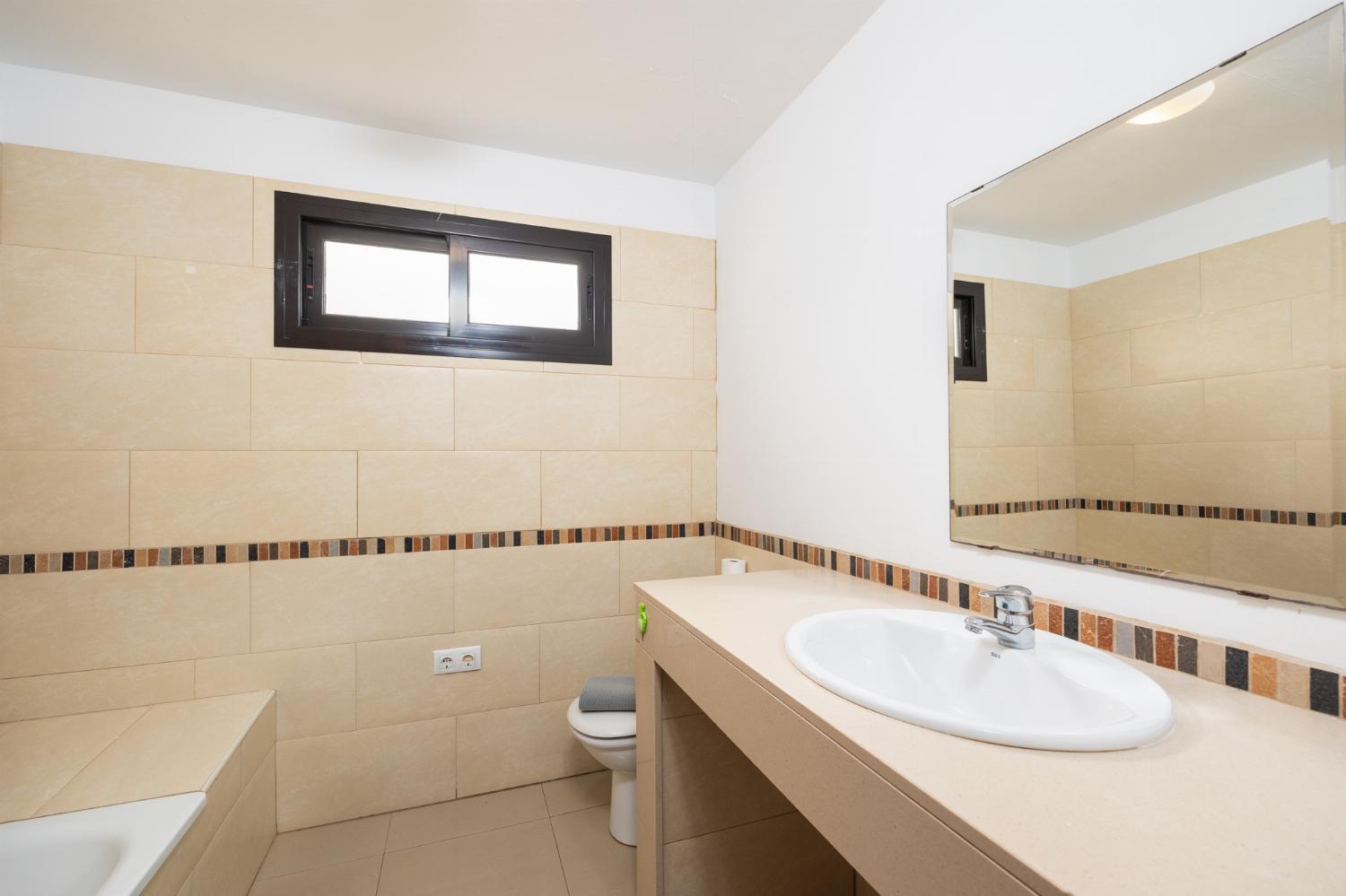 Family bathroom with bath and shower