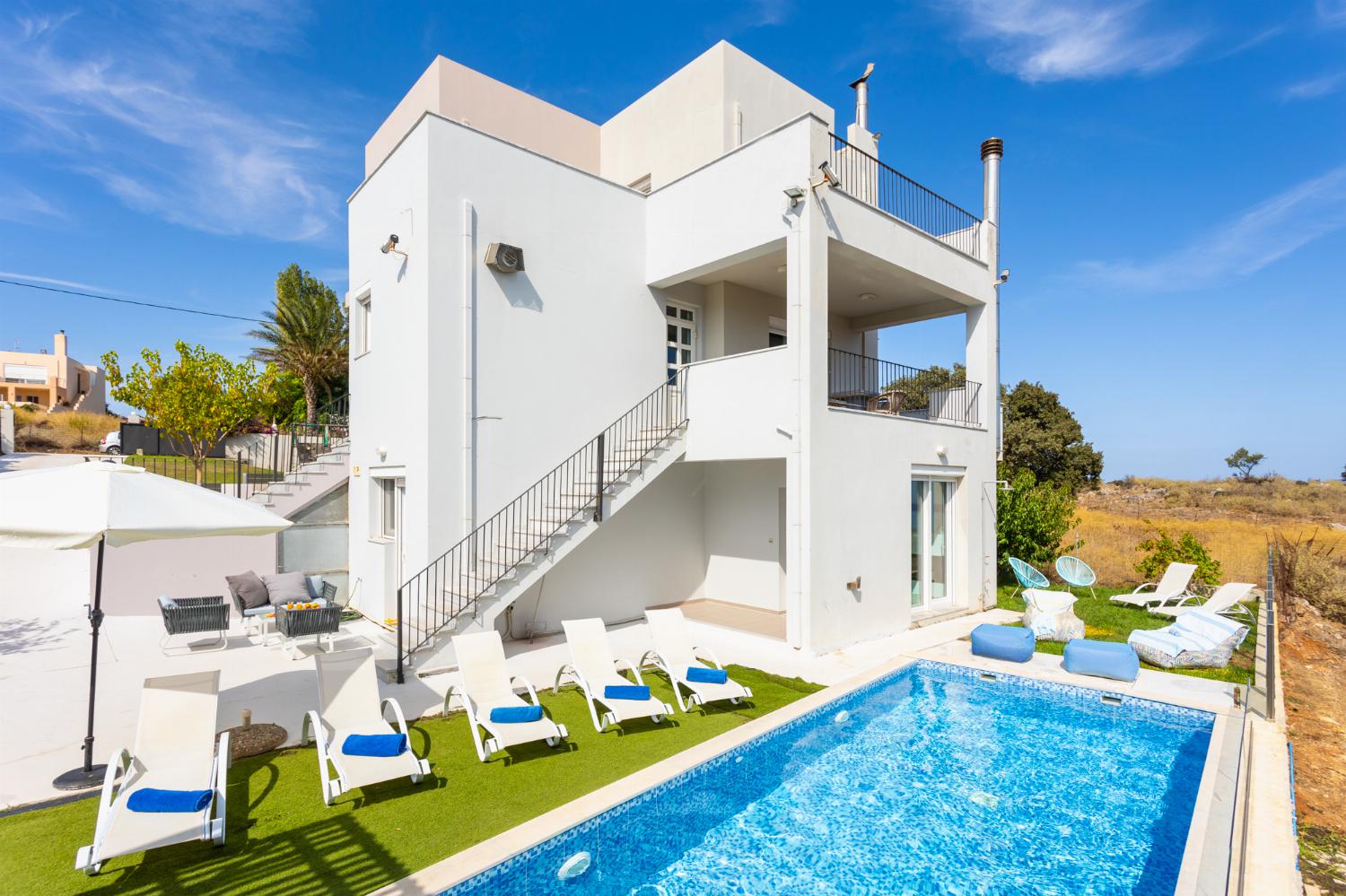 ,Beautiful villa with private pool, terrace, and garden with sea views
