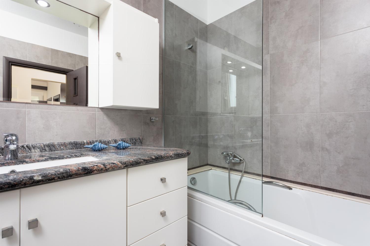 Family bathroom with bath and shower