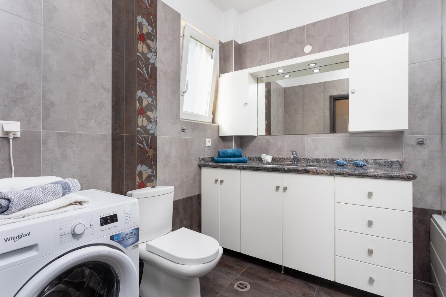 Family bathroom with bath and shower