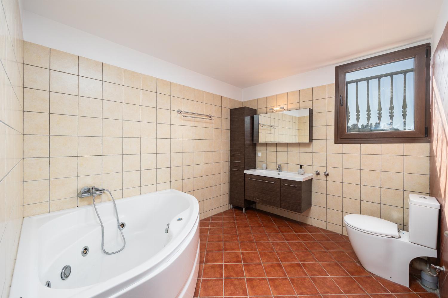 Family bathroom with bath and shower