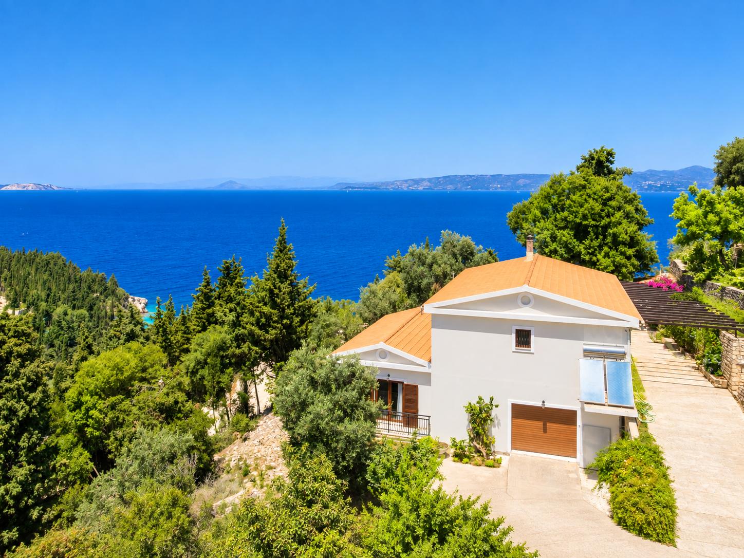 ,Beautiful villa with private pool, terraces, and garden with panoramic sea views