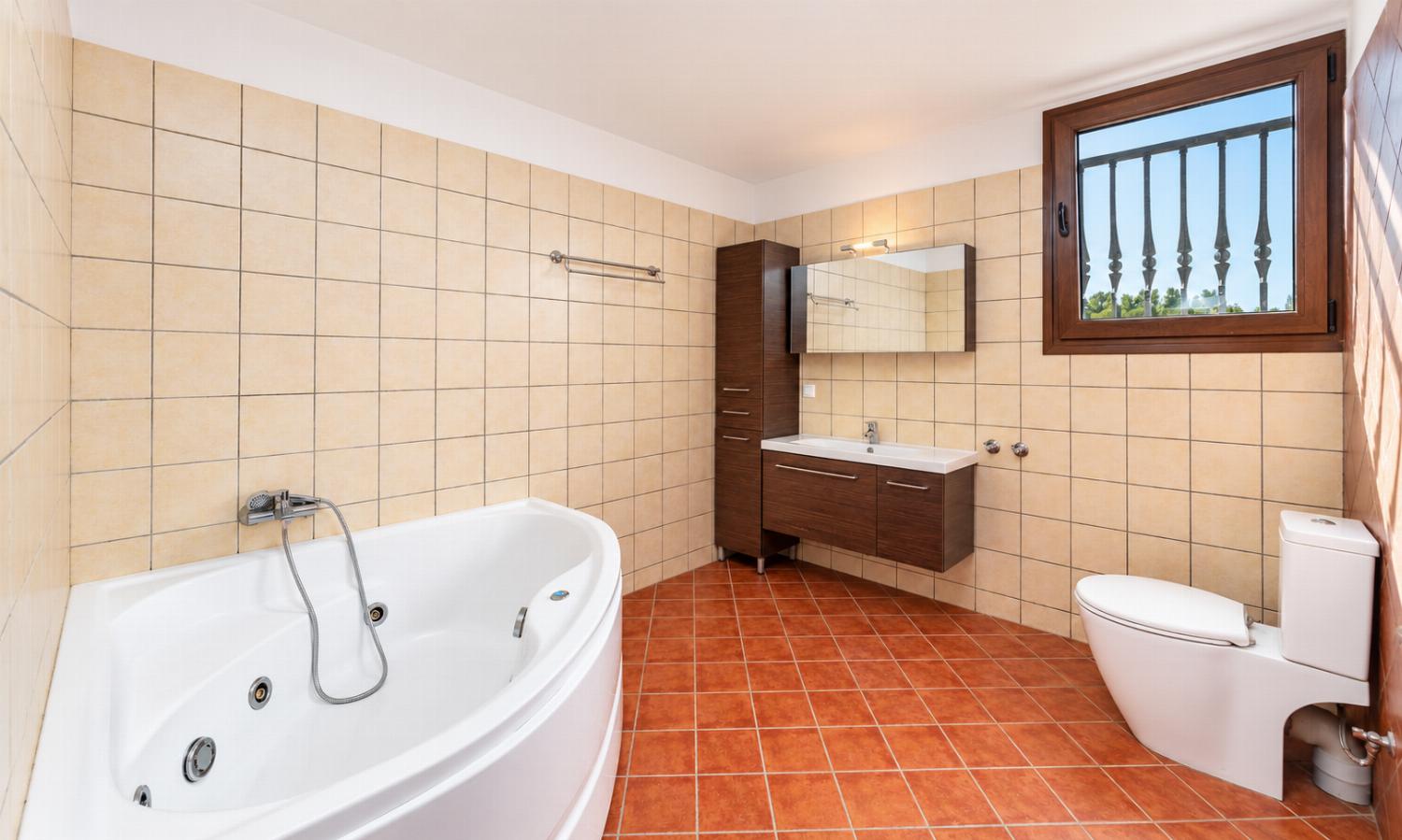 Family bathroom with bath and shower