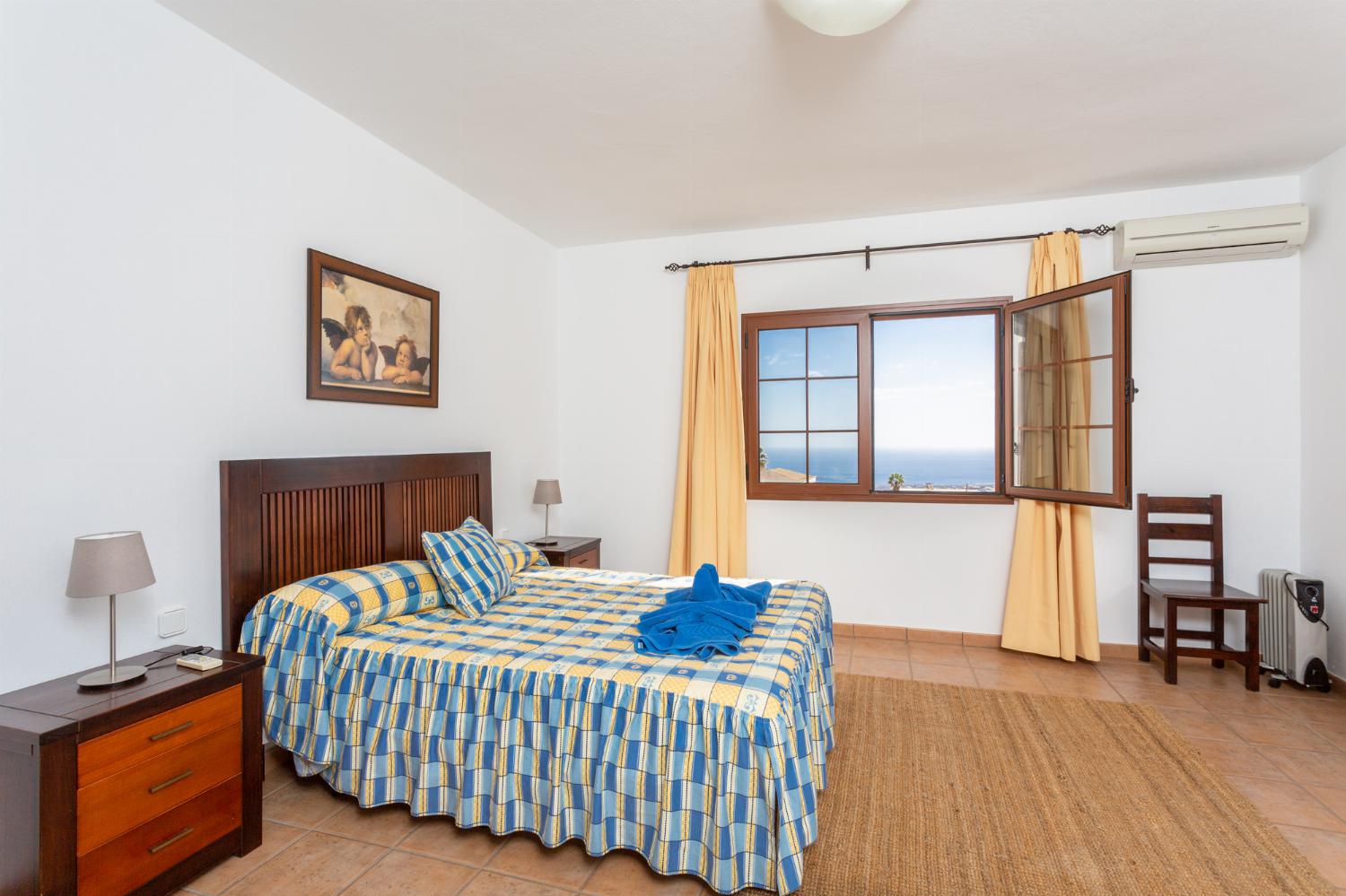 Double bedroom with en suite bathroom, A/C, and sea views
