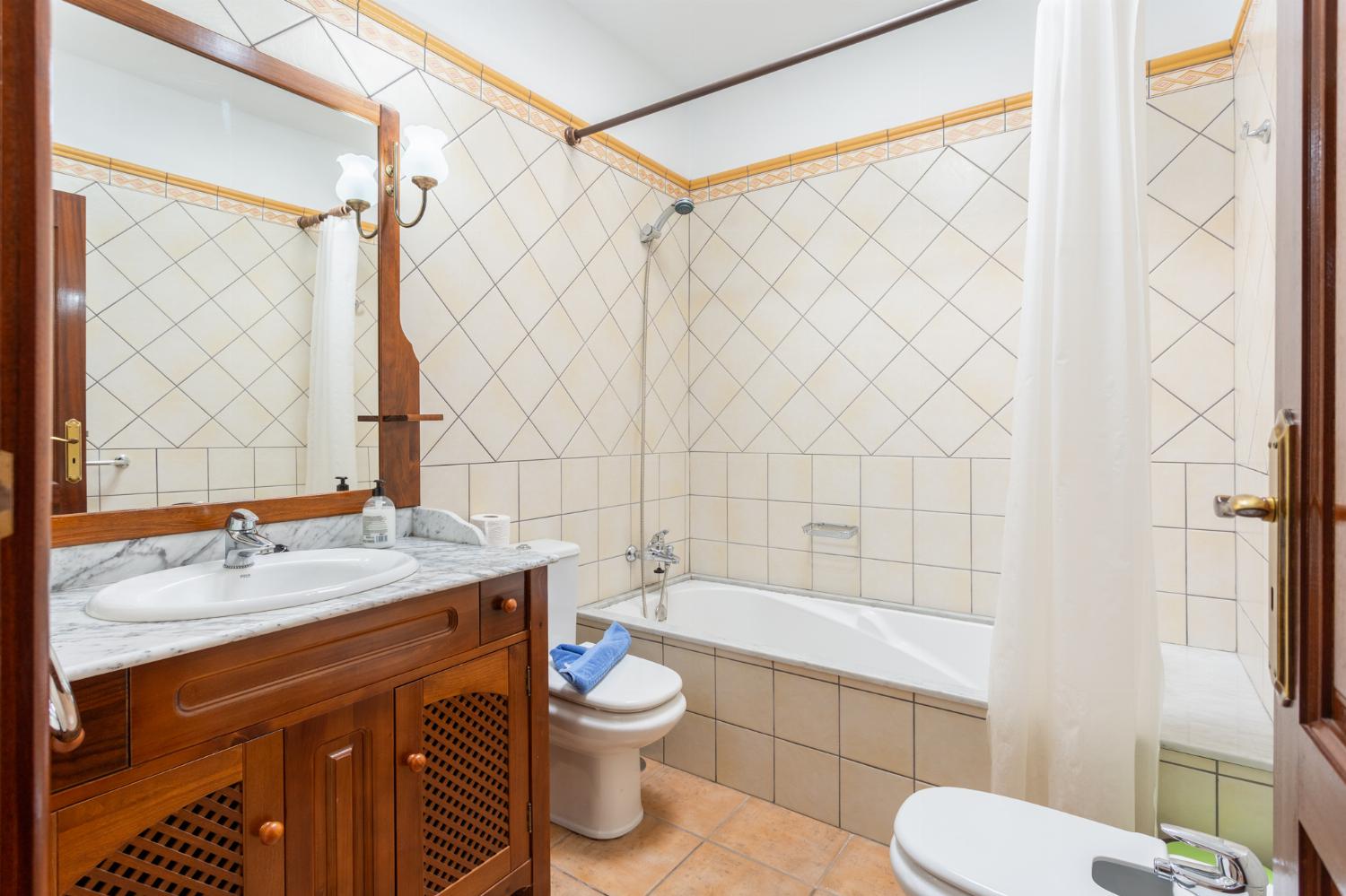 Family bathroom with bath and shower