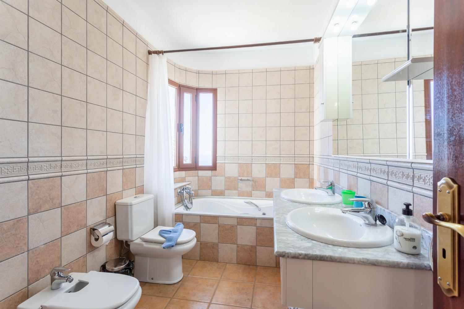 Family bathroom with bath and shower