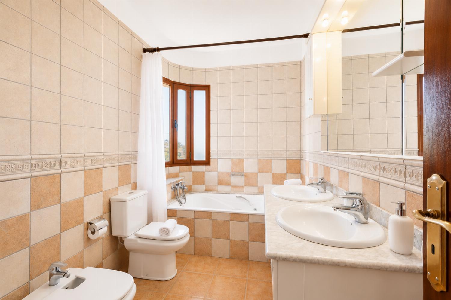 Family bathroom with bath and shower