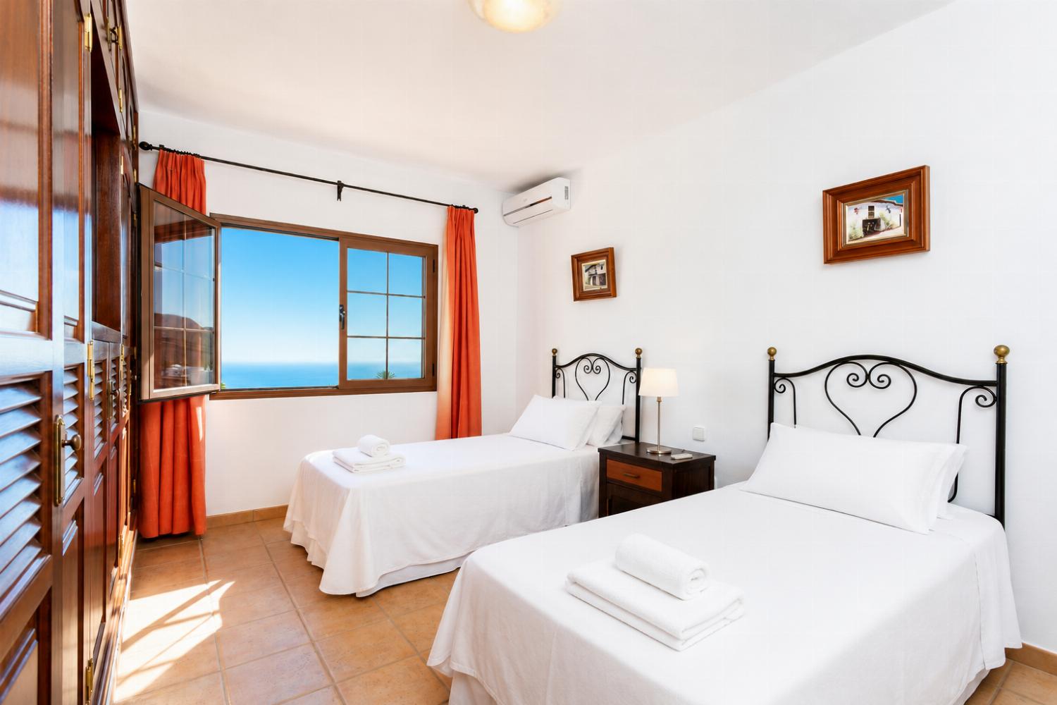 Twin bedroom with A/C and sea views