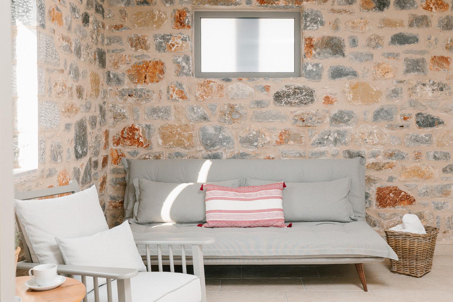 Open-plan living room with sofas, dining areas and kitchen