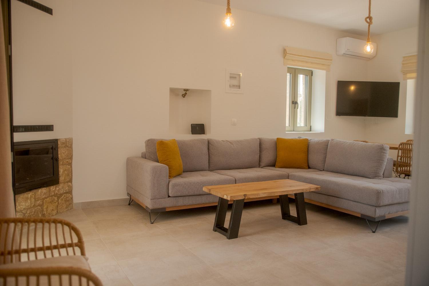 Living room with ornamental fireplace and A/C