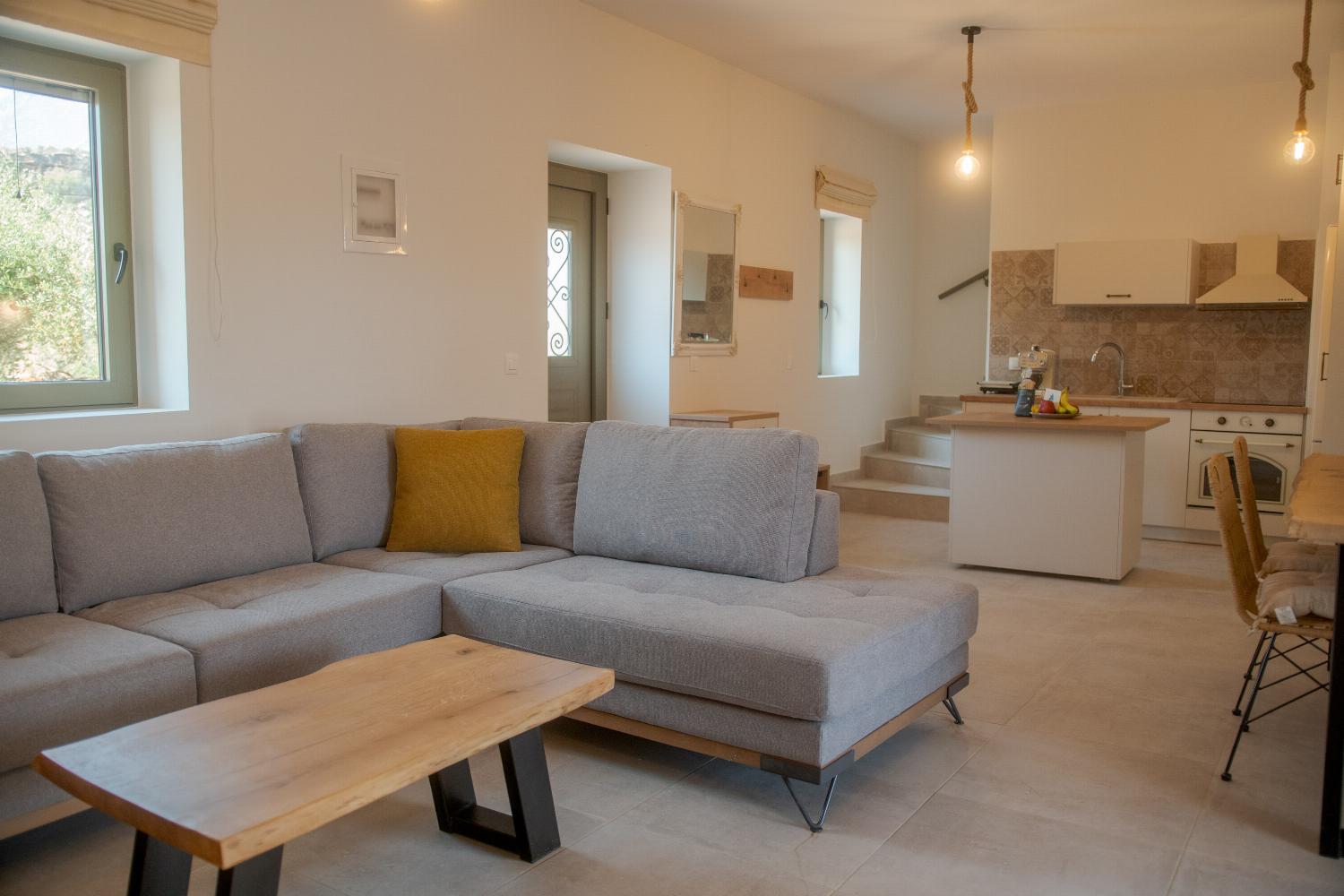 Open plan living room, dining area, and kitchen