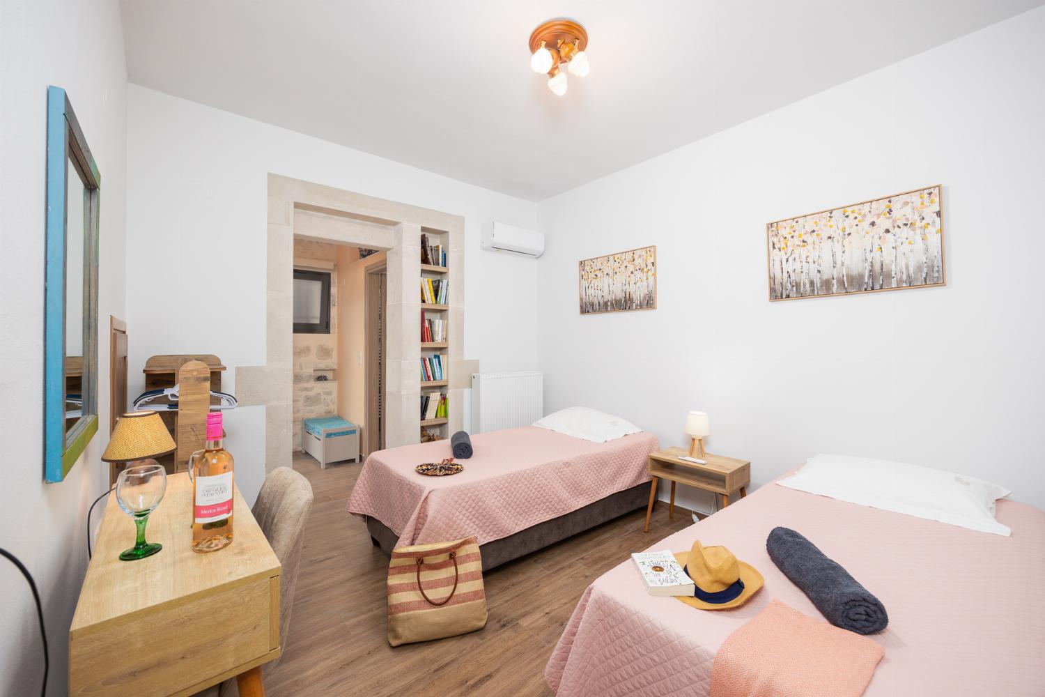 Twin bedroom with en suite bathroom and A/C