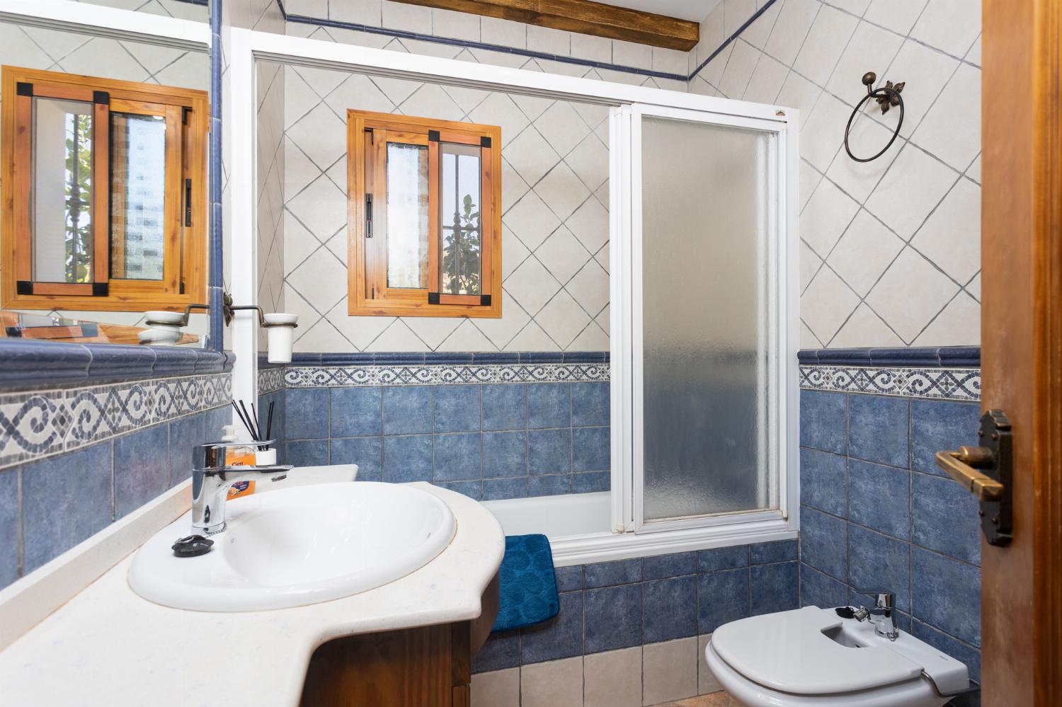 Family bathroom with bath and shower