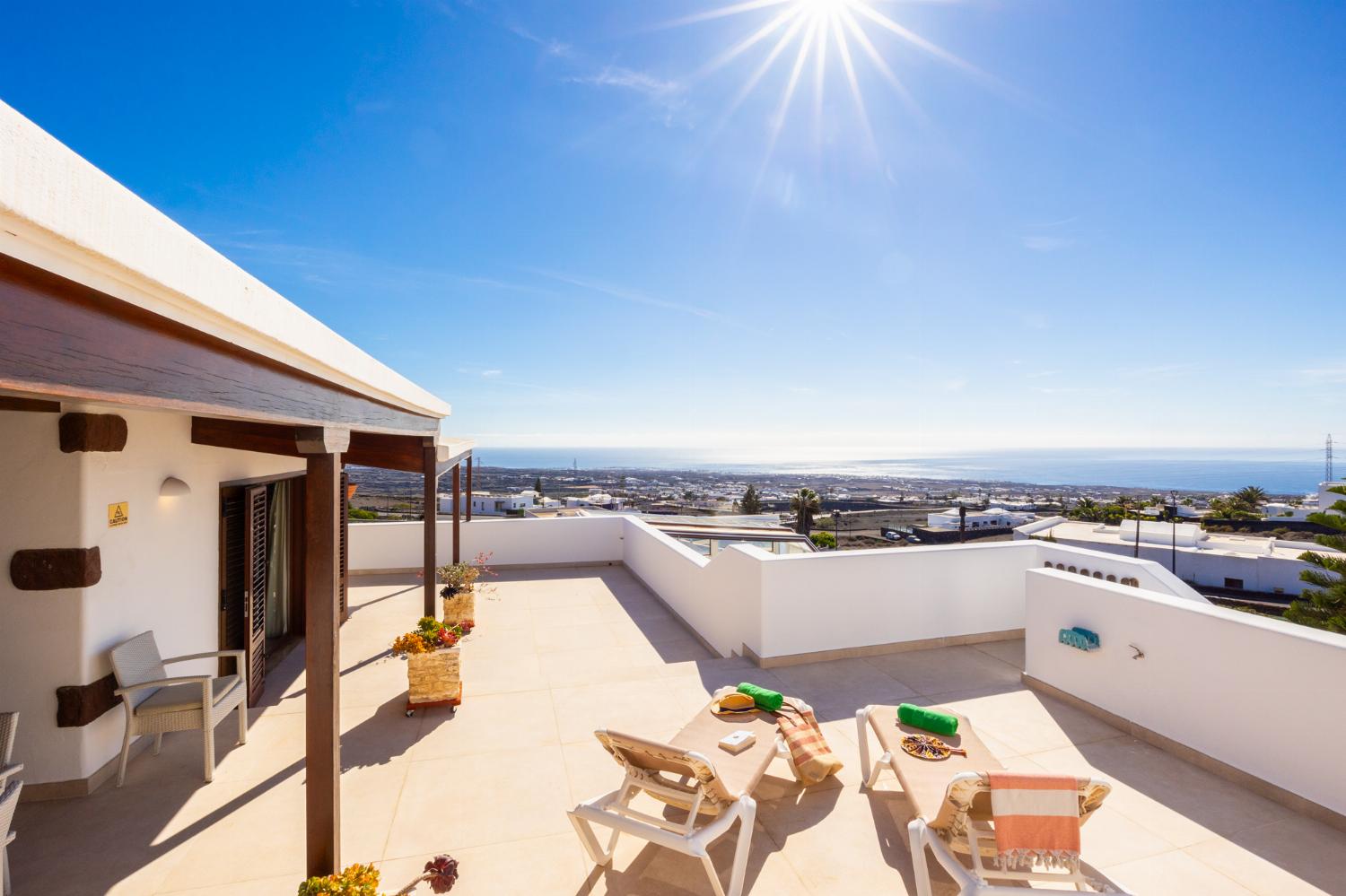 Upper terrace area with sea views