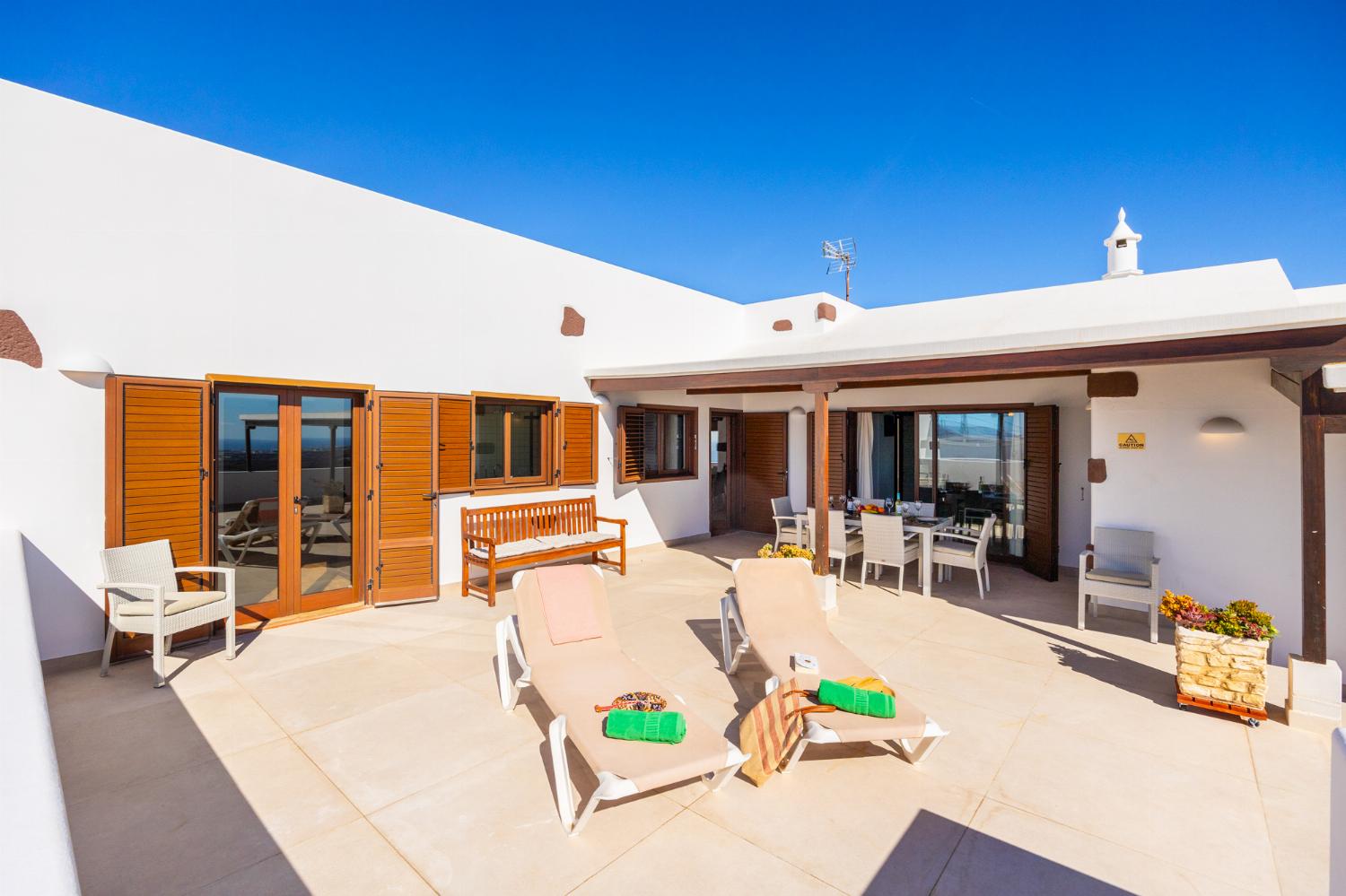 Upper terrace area with sea views