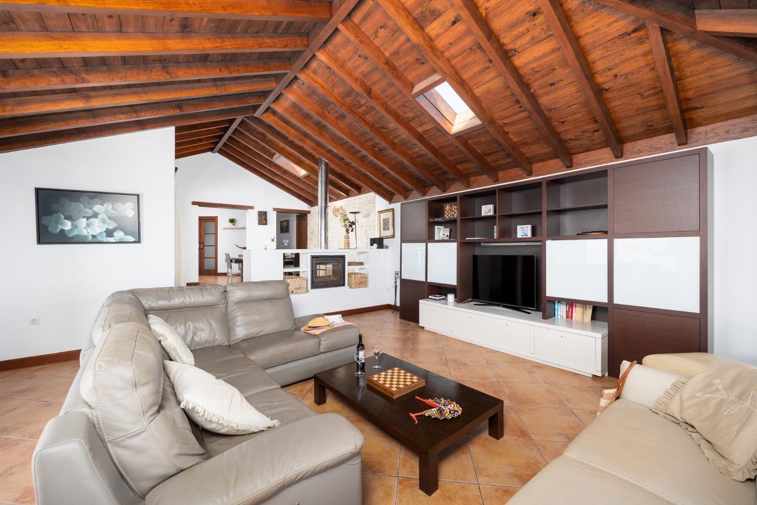 Living room with sofas, dining area, WiFi internet, satellite TV, and sea views