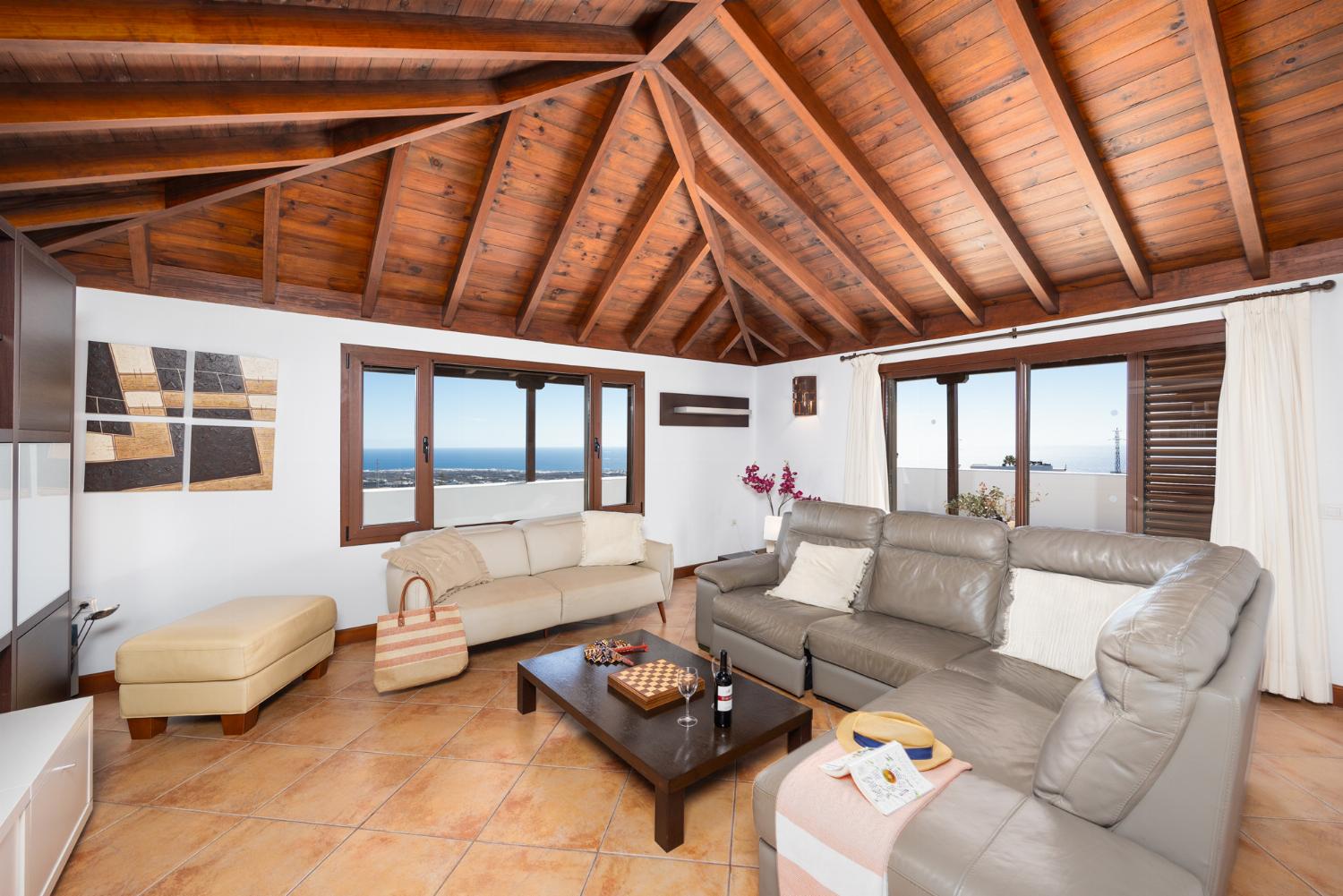 Living room with sofas, dining area, WiFi internet, satellite TV, and sea views