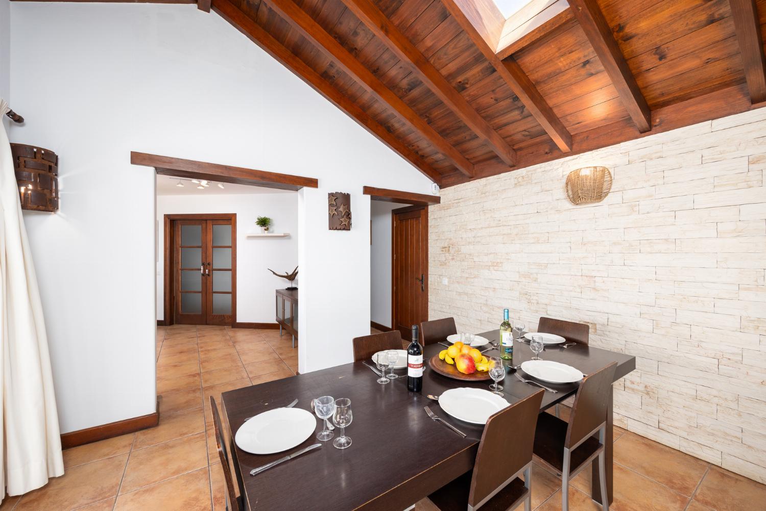Living room with sofas, dining area, WiFi internet, satellite TV, and sea views