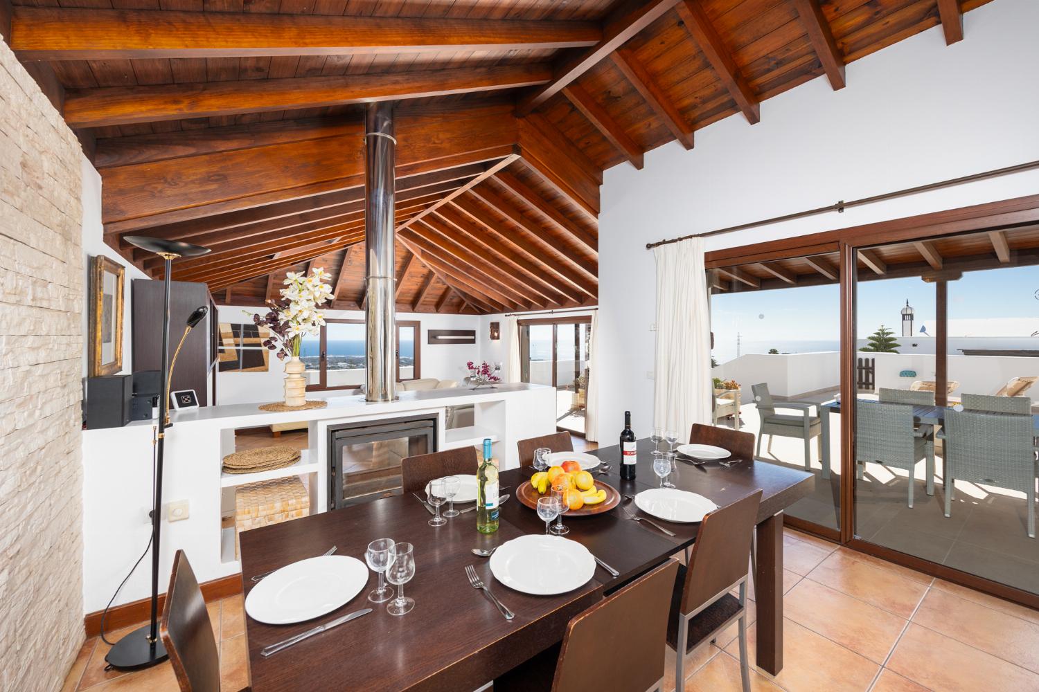 Living room with sofas, dining area, WiFi internet, satellite TV, and sea views