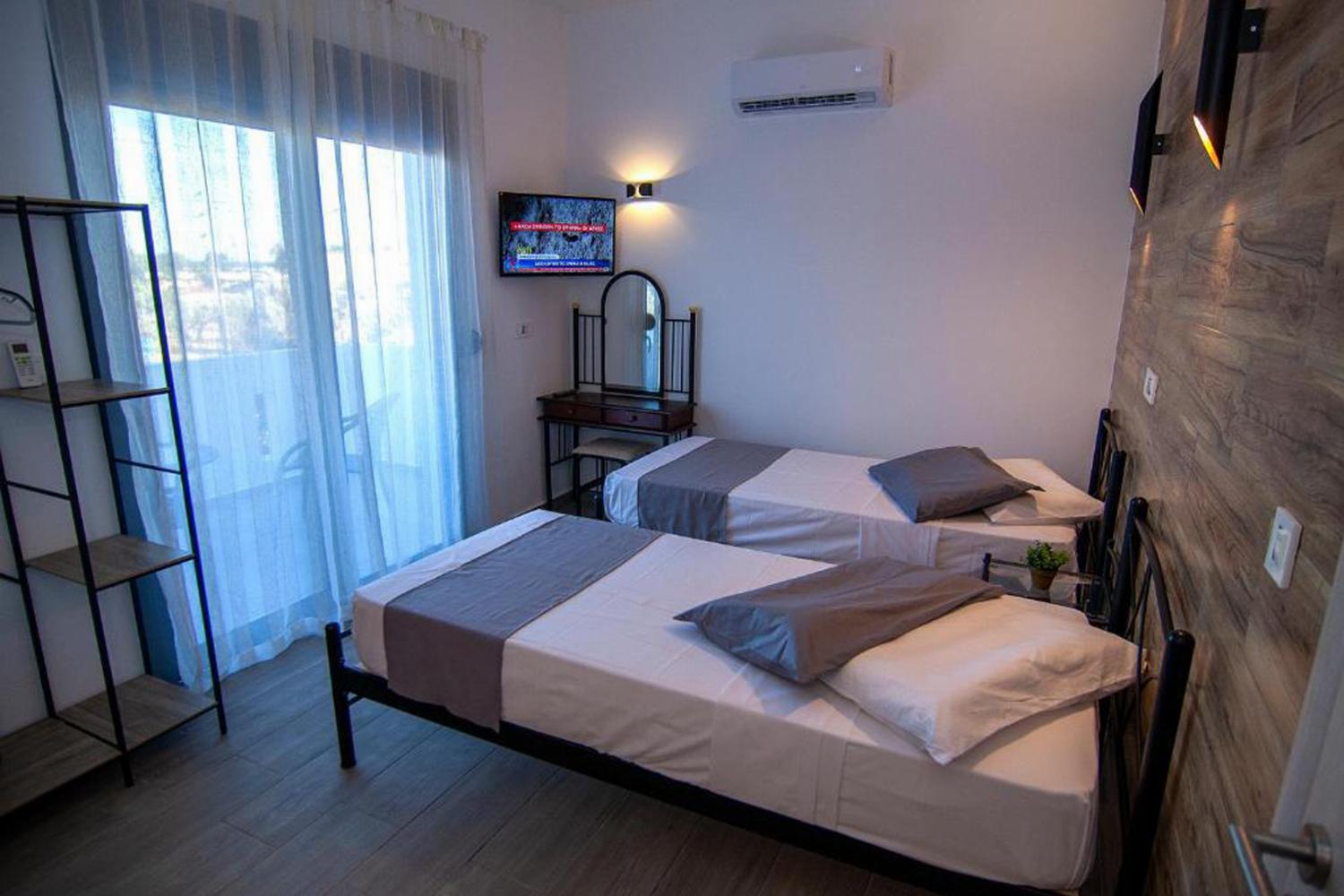 Bedroom with three single beds