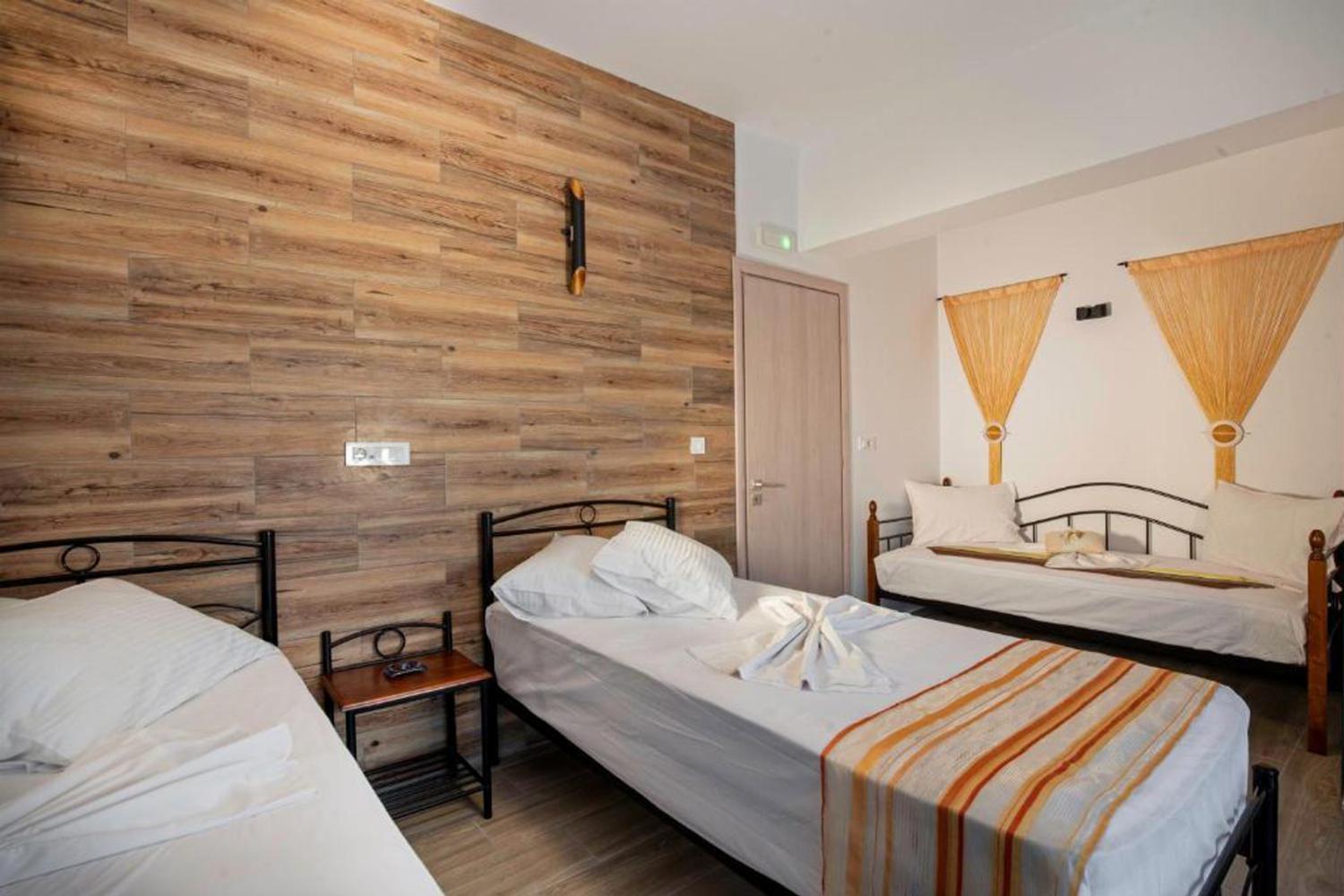 Bedroom with three beds